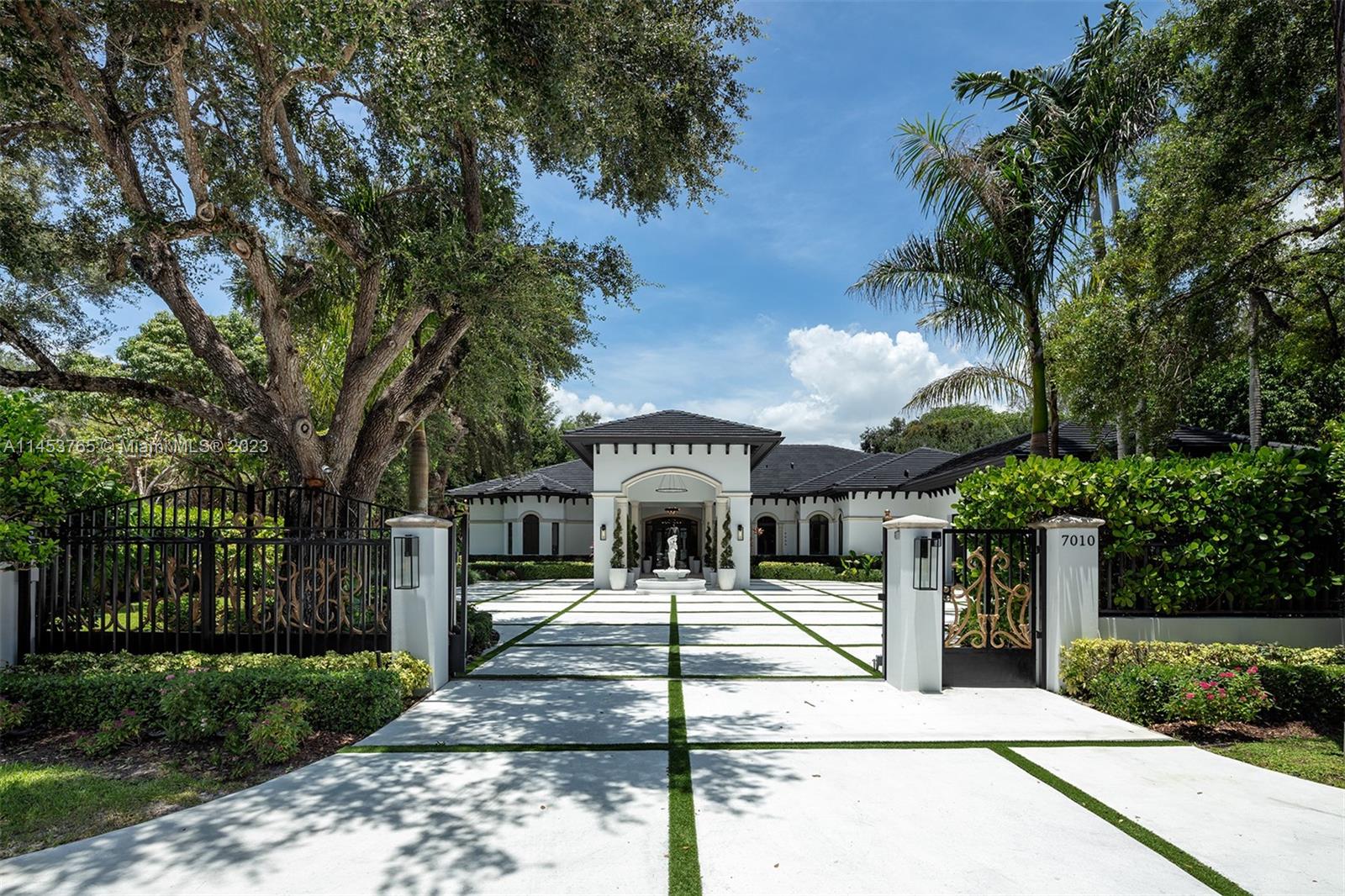 Introducing Fountain Manor, an Exquisite, recently built, fully furnished & gated Mediterranean gem in the heart of S. Miami, featuring a detached guesthouse overlooking the resort-style backyard built for relaxation & entertainment. Newly updated turnkey home radiates luxury w/ high-end finishes, extensive upgrades, designer furnishings & verdant landscaping. Eye-catching design & materials at every turn. Elegant entrance foyer & great room overlook the shimmering pool & manicured putting green. Open floor plan chef's kitchen w/ custom stonework opens to expansive family room & breakfast nook. Large primary suite w/ dual his & her mahogany walk-in closets. Add'l Gym, wine cellar, & laundry. Heated saltwater pool + spa, outdoor kitchen, putting green & integrated security system.