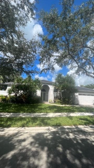 Beautiful 5 bedroom and 4 full bath home w/ pool in Weston Hills CC. Totally renovated with custom design kitchen, new flooring new appliances, new and updated bathrooms, new lighting and new roof. Modern design with a sophisticated look. Two Championship 18 Hole Golf Courses, private community 24 hr guards, and breathtaking views, walking trails, parks and A+ Schools, perfect place to live in S. Florida. Top notch community and home.