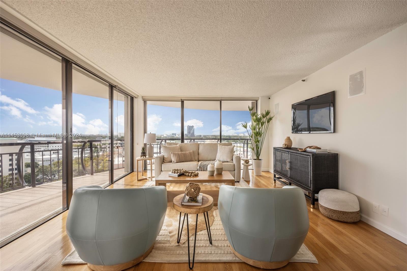Enjoy panoramic city and bay views from this high-floor residence in Grove Towers. Located just steps from the Grove village’s galleries, boutiques, cafes and bayfront parks & marinas. Spacious, light-filled unit with floor-to-ceiling windows that open to a large wrap-around balcony from living, dining & both bedrooms. Opportunity to update the original kitchen & baths to your custom specifications. Separate (in unit) laundry room. The building’s 40 year recertification has been completed. Grove Towers is exceptionally well-managed & serviced by experienced, long-term staff. Enjoy recently renovated amenities- including fitness center, pool & tennis courts. Just minutes to downtown, MIA, Coral Gables, Key Biscayne & the Beaches.