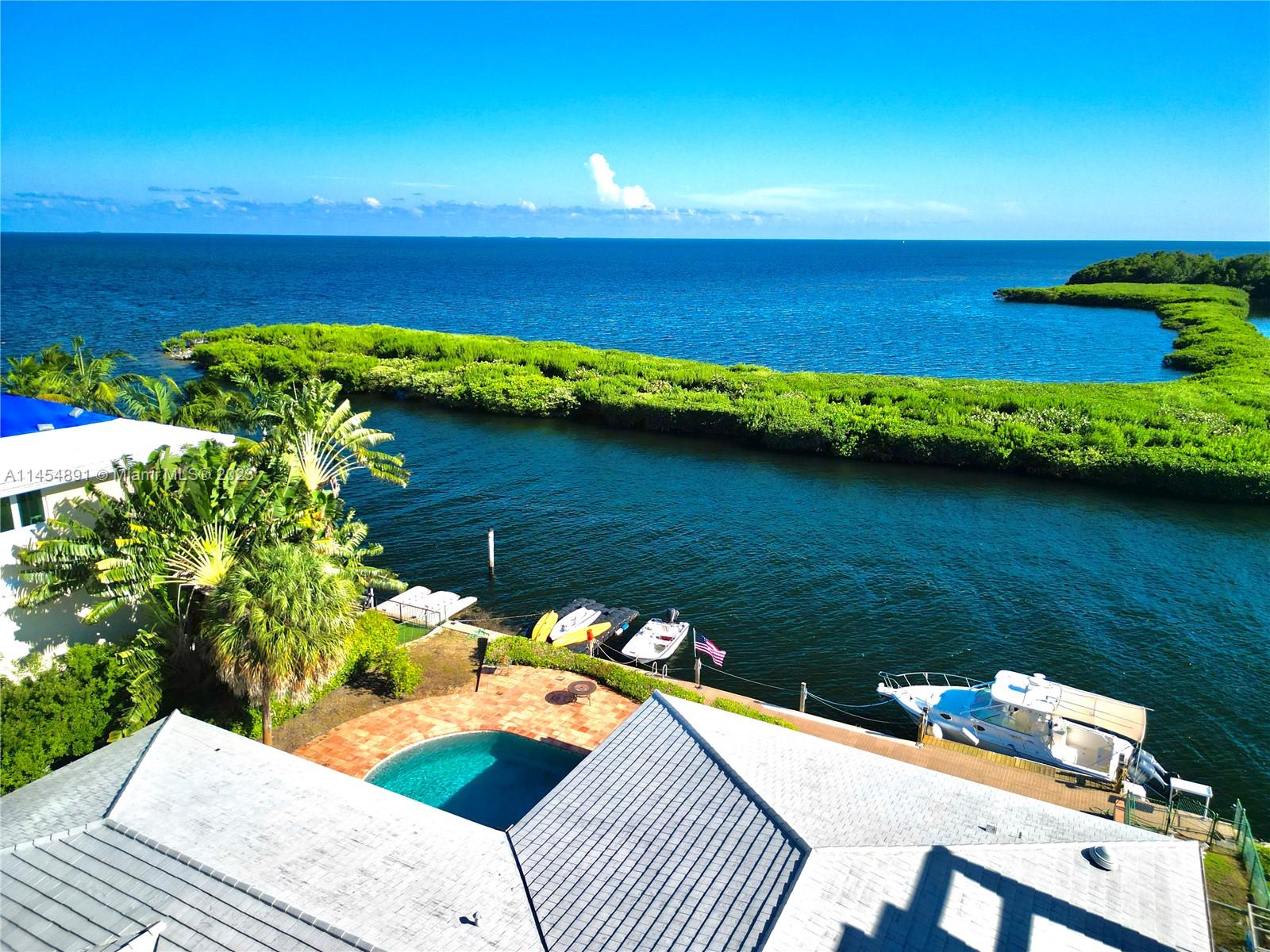 Do not miss this rare opportunity to purchase property on the bayfront “golden corner” of Gables by the Sea.  This 12,000 square foot lot features 100 feet of seawall on deep water.  When you have built your dream house on this property you will have spectacular wide views of Biscayne Bay.  Spot Fowey lighthouse and Soldier key on the horizon.  Have coffee with golden sunrises and watch spectacular evening light shows from distant thunderstorms.  Watch the tarpon roll from your backyard while manatees swim by.  You will have amazing bay views yet your yacht and property will be protected from storms by a low mangrove breakwater (see photos).  Leave your dock and you will be out of the channel and up at full speed in less than 3 minutes. Endless possibilities!