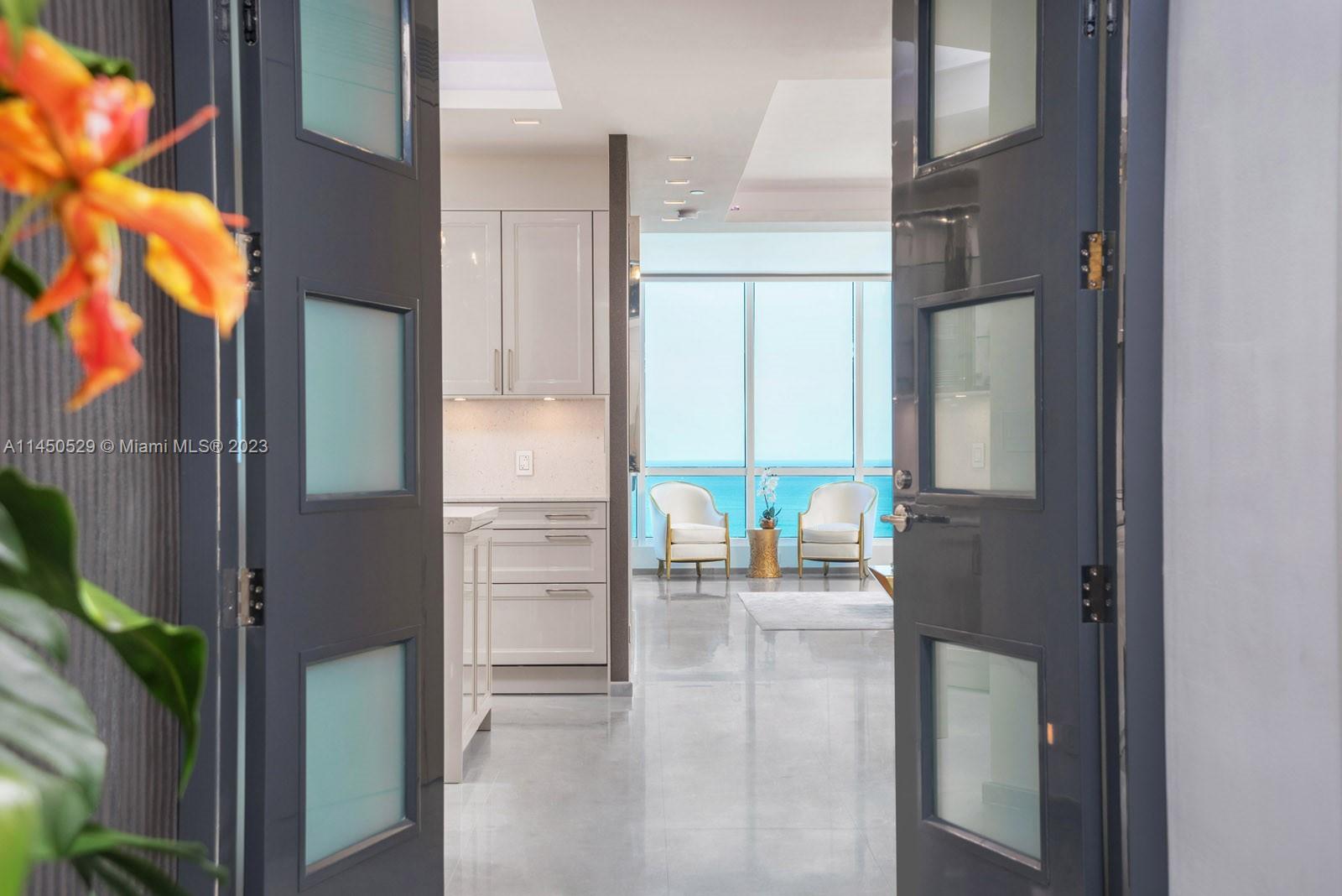 Designer decorated and custom tailored w/the most luxurious finishes. The moment you enter this spectacular and desirable 06-line residence from your private elevator foyer w/double door entry you will be amazed by the breathtaking Ocean View along the entire Beach. This exclusive residence went through years of extensive renovation and features only the finest and best materials/ finishes. Very scarce Italian light grey marble floors w/special effects, Siematic German kitchen w/Miele + Subzero appliances, Porsche Design lighting, Piano lacquered doors, cinema rated wall insulation, Cavalli Wall paper, Neff closets, Dornbracht fixtures, no expenses have been spared +just to mention a few of this completely upgraded Residence. List w/upgrades available! Hardly lived in, like new! Converted!