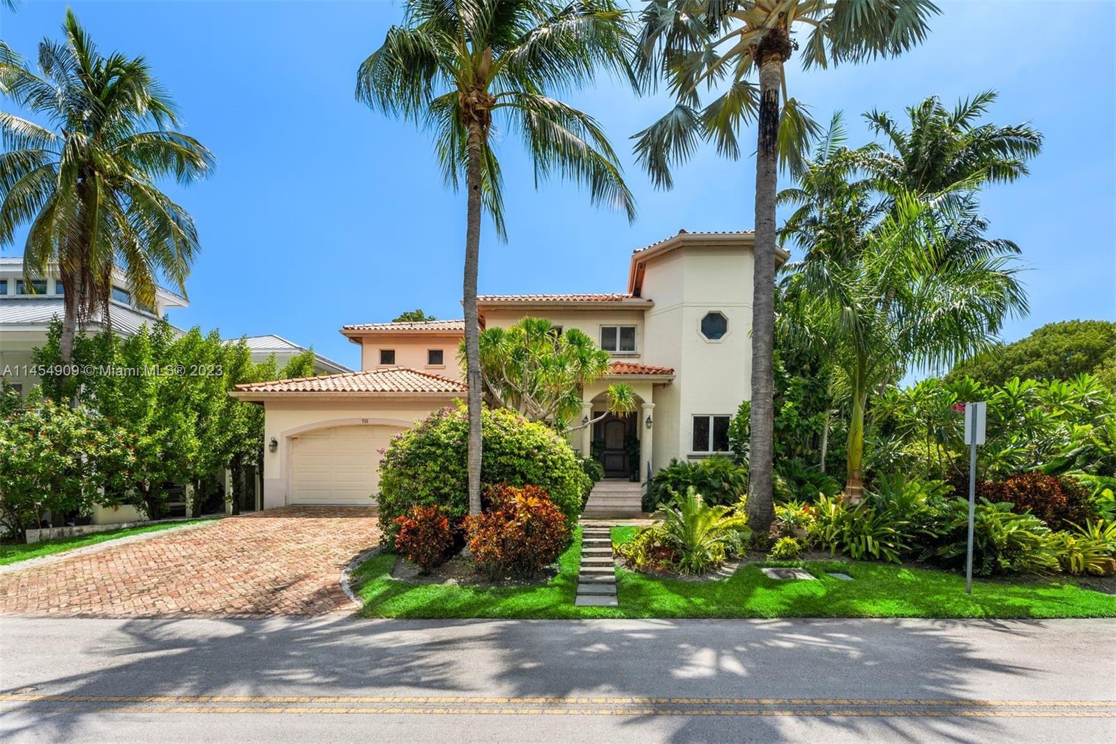 This elegant home is located on prestigious Harbor Drive in a corner lot surrounded by lush landscaping creating a serene private oasis.  This two-story residence is elevated, and the interior combines classic elements with modern finishes and large windows, which allow natural light to flood the interior.  Built in 1995 this is a stunning blend of classic and contemporary design offering luxurious and comfortable living space that complements the beauty of its tropical surroundings.  Featuring 5 spacious bedrooms, including a luxury master suite and 5 bathrooms, separate office, large family room, 2 car garage and a magnificent pool and terrace area with tons of privacy. This floor plan is extraordinary for any family that appreciates the Key Biscayne lifestyle and community.