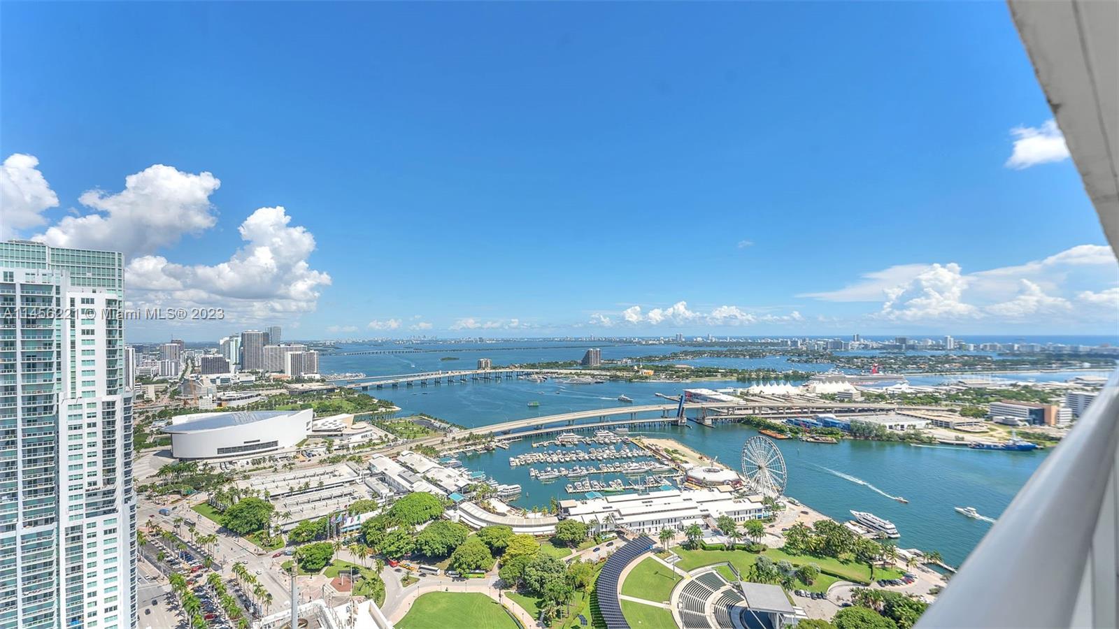 One-of-a-kind apartment in the heart of Downtown. This remodeled corner unit features a unique open-flow floor plan, the largest of this line, with porcelain floors throughout and remodeled baths with a distinctive style. The master bath features a jacuzzi-style tub and a separate shower. All closed are finished. Very bright apartment with floor-to-ceiling windows and a wraparound balcony to enjoy sunset & sunrise views. The best of the best. This building is located in the heart of downtown, with Whole Foods, Bayfront Park, fine dining restaurants, cinema, and cafes.  The great amenities include, a large swiming pool, an expansive sundeck with cabanas, pilates room, yoga room, gym, business center, social rooms & more. The parking is conveniently located on the 3rd floor. A MUST SEE!