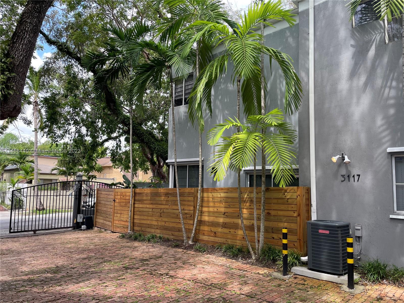 "Free Standing" town home with three bedrooms, two and a half bath in a gated complex of nine units. Just two blocks from Downtown Coconut Grove. Open floor plan. High ceilings both on the first and the second floor. Lots of natural light through out the day. This unit is detached from other units and has extra windows. Two assigned parking spaces. Spacious primary bedroom with walk in closet. Primary bathroom with double sink. Two more nice size bedrooms, overlooking the mature oak canopy. Private, bricked patio, excellent for entertaining and quiet times.  Please see the attached roof report for more info.