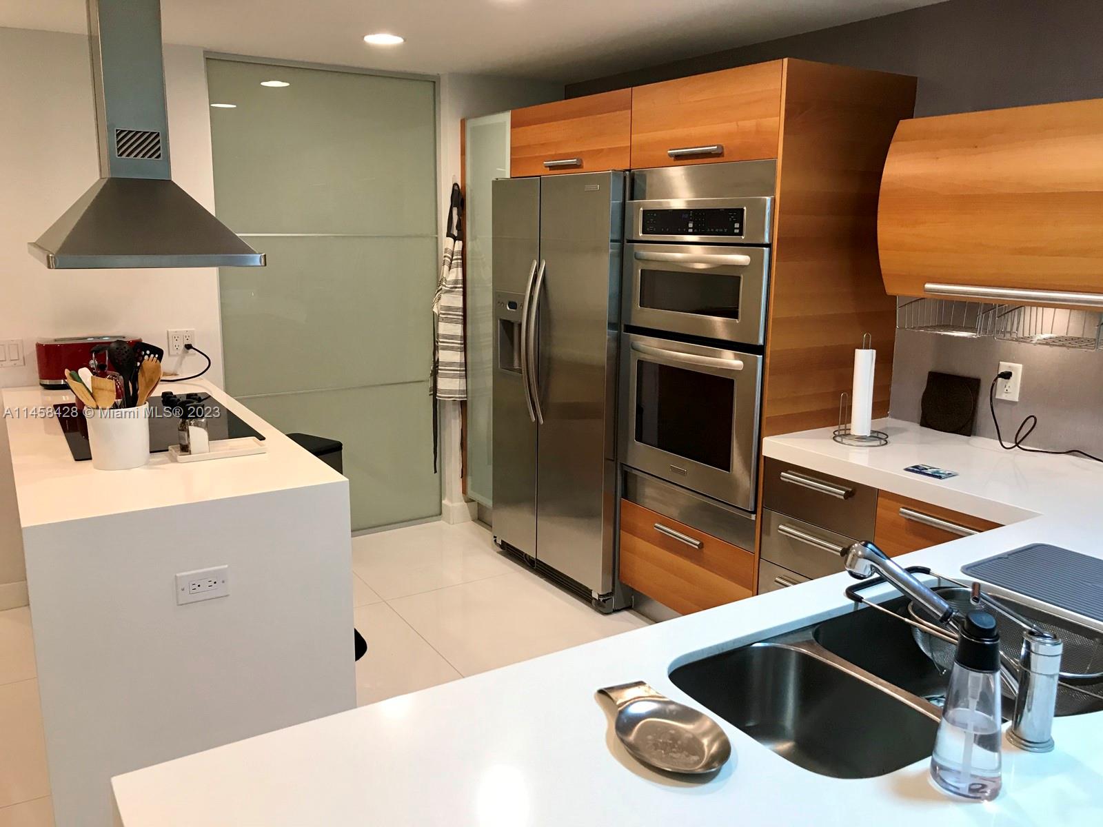 GREAT LOCATION.   Move to this oversized 2 br 3 bath designer duplex condo with bonus den.   over 1500 sq feet, three balconies, two overlooking the canal connecting to the intracoastal.  Tiled throughout, amazing master bedroom with private tub and shower, second bathroom and washer/dryer with second bedroom both on the upper floor.   first floor den converted to third bedroom with bunk beds.   Living/dining/kitchen/den and full bath on the first floor.   Walk to A rated Aventura Charter elementary school virtually across the street.  Ample shopping and restaurants nearby.   amazing pool, gym, tennis courts, 24/7 front desk, assigned parking and more.