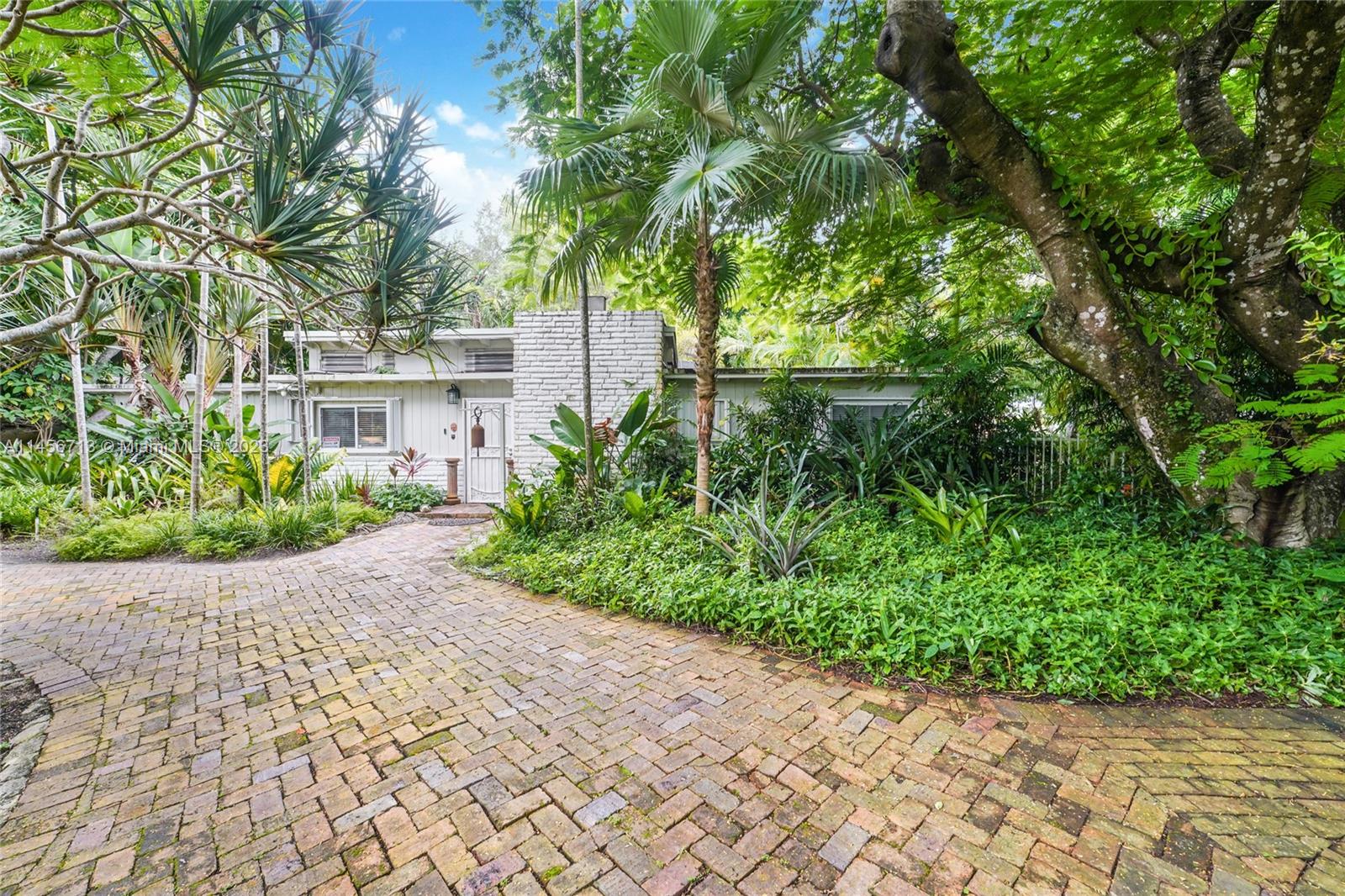 Developer opportunity- divide the lot into 2 lots of 15,000+ each & build 2 homes. -OR- Knock down the existing structure and build 1 expansive dream home on nearly 3/4 of an acre. The possibilities are endless.  An entrance exists on 59 St. and 60 St. This tropical oasis and sanctuary has a 3/2 designed by renown mid-century architect Alfred Browning Parker and the lot boasts mature palm trees, exotic plants, a fantastic Banyan tree that is nearly 100 + old, fruit trees, bamboo, etc. 15 X 30 Pool w/ coral fountain.   Minutes away from the best neighborhoods, shops, restaurants, entertaining, prestigious & top rated schools Miami.  A few minutes from S.Miami, Coral Gables, Coconut Grove & Pinecrest, Whole Foods & one of the Top Rated Hospitals in Miami- Baptist Health S. Miami Hospital.
