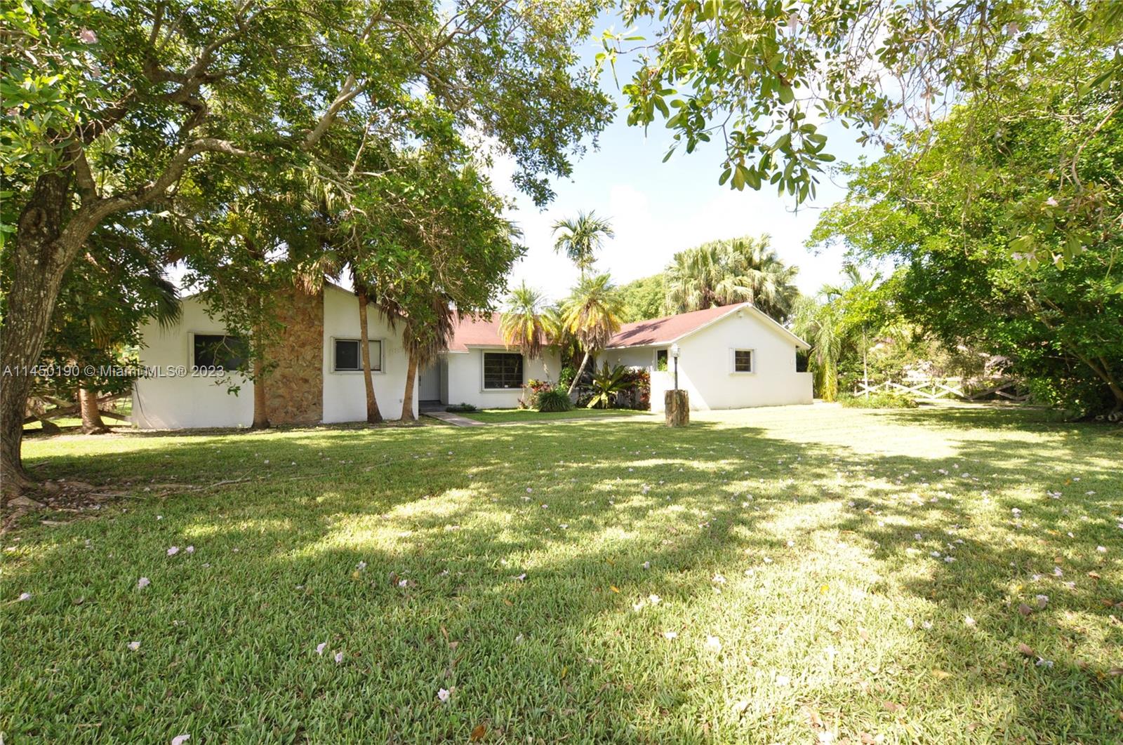 Step inside to discover contemporary living. This remodeled 5bed/3bath single family home is located in a quiet and desirable neighborhood, and sits on a large 37,000+ sf lot, which affords lots of privacy and space to entertain guests. This home features high vaulted ceilings, numerous french doors, a private split bedroom floor plan, porcelain floors, and lots of closet space throughout the home. The open kitchen is equipped with sleek quartz countertops, modern SS farmhouse sink and appliances, garbage disposal, and ample storage. The master suite boasts high vaulted ceilings, en-suite bathroom, and spacious walk-in closet. Step outside and enjoy the large covered terrace and fruit trees (banana, mulberry, etc.) spread throughout the property. Plenty of room for a pool and guest house.