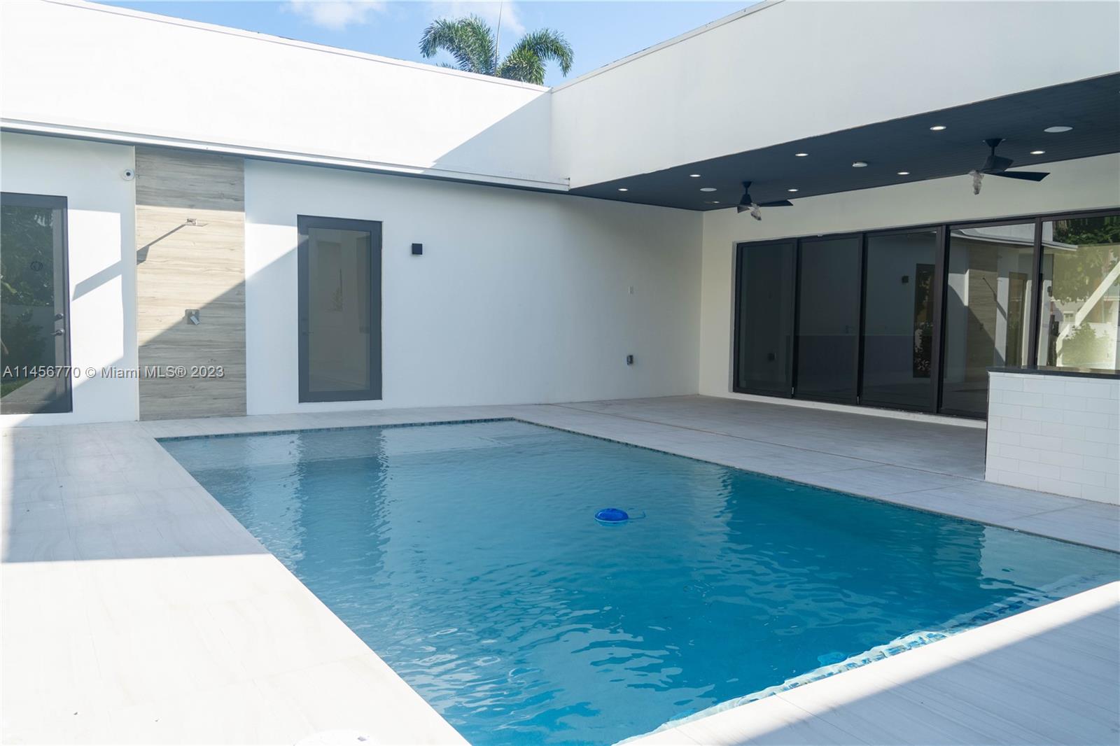 Step into the epitome of modern luxury living! This exquisite estate offers 4 bedrooms and 3 bathrooms as well as a host of remarkable amenities. Upon entering, you'll be captivated by the open-concept design with high ceilings and oversized kitchen. 

The master bedroom offers a freestanding tub for leisurely soaks and a custom walk in closet.

The heated pool includes color-changing lights and an outdoor shower. Also, there are two outdoor fans as well as an outdoor barbecue area! The living room bar, complete with a sink, is an entertainer's dream. The property is equipped with a camera security system and a Wi-Fi hob doorbell camera. Plus, insulated garage doors.

This property is an extraordinary estate. With it's stunning outdoor amenities, and meticulous design. Welcome home!