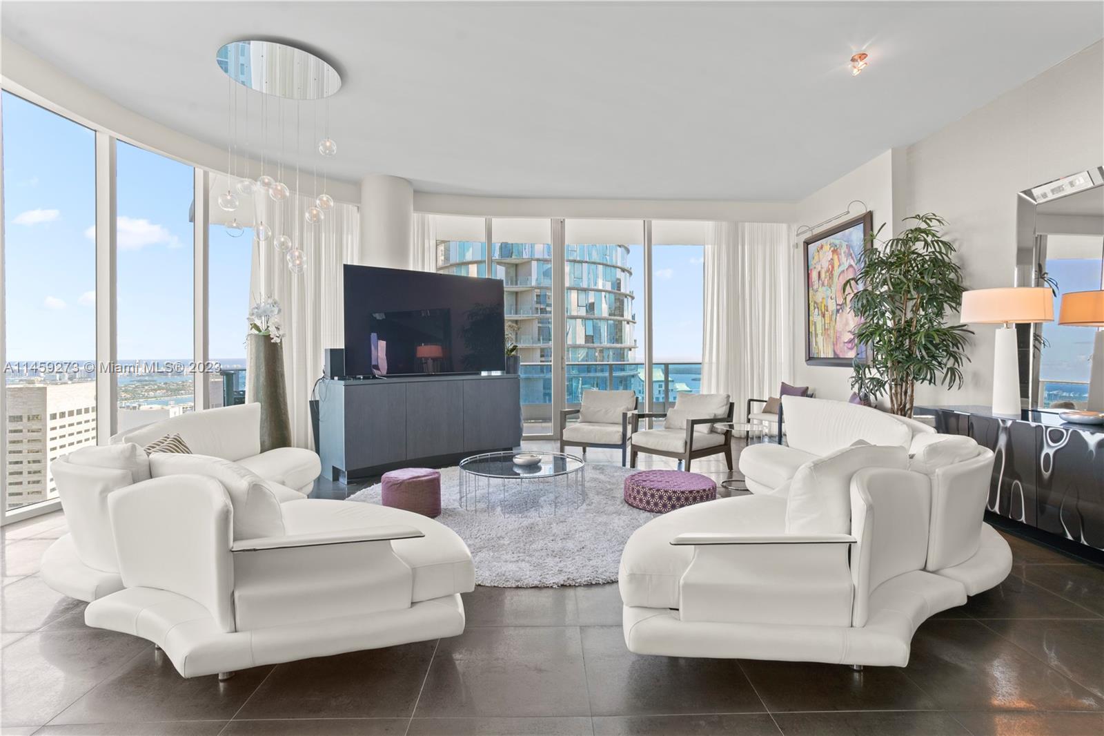 Epic Residences presents an exquisite living experience with its spacious 3 bedrooms, 3.5 bathrooms, and 3 balconies, including an expansive 575 sqft main terrace. The Master Suite featuring His and Hers Walking Closets adds a touch of opulence to the space. Floor-to-ceiling windows offer breathtaking panoramic views of Miami Beach, Brickell, Brickell Bay, and Downtown Miami. This luxury living experience extends beyond the individual units, with exceptional building amenities. Residents can indulge in the culinary delights of Miami's most popular restaurants, Zuma and Area 31. Additionally, the Exhale Fitness Center & Spa ensures residents can maintain their well-being in style. Two infinity pools provide relaxation and a place to unwind, while access to the marina adds a nautical dimens