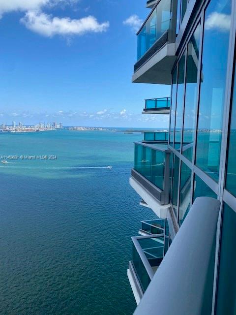 Stunning Corner residence perfectly positioned to capture the best views of the Brickell skyline, The Biscayne Bay, the port of Miami and Key Biscayne. Indulge beautiful sunrises and sunsets from your living room  with Floor to ceiling windows and be ready to enjoy over 400 SF of Terraces overlooking the City and the Bay. Residence offers a very ample split floorplan with 2 Bedrooms and 2 Baths, marble flooring throughout, walk in closets and a private dedicated elevator entry that enhance your foyer and residence. Kitchen features Snadeiro cabinets as well as European appliances ( Miele). Jade Brickell is a five- star setting including European- inspired Spa, 2 infinity-edge swimming pool with direct  view of the Bay, massage treatment room, racquetball court, rooftop sky lounge and more.