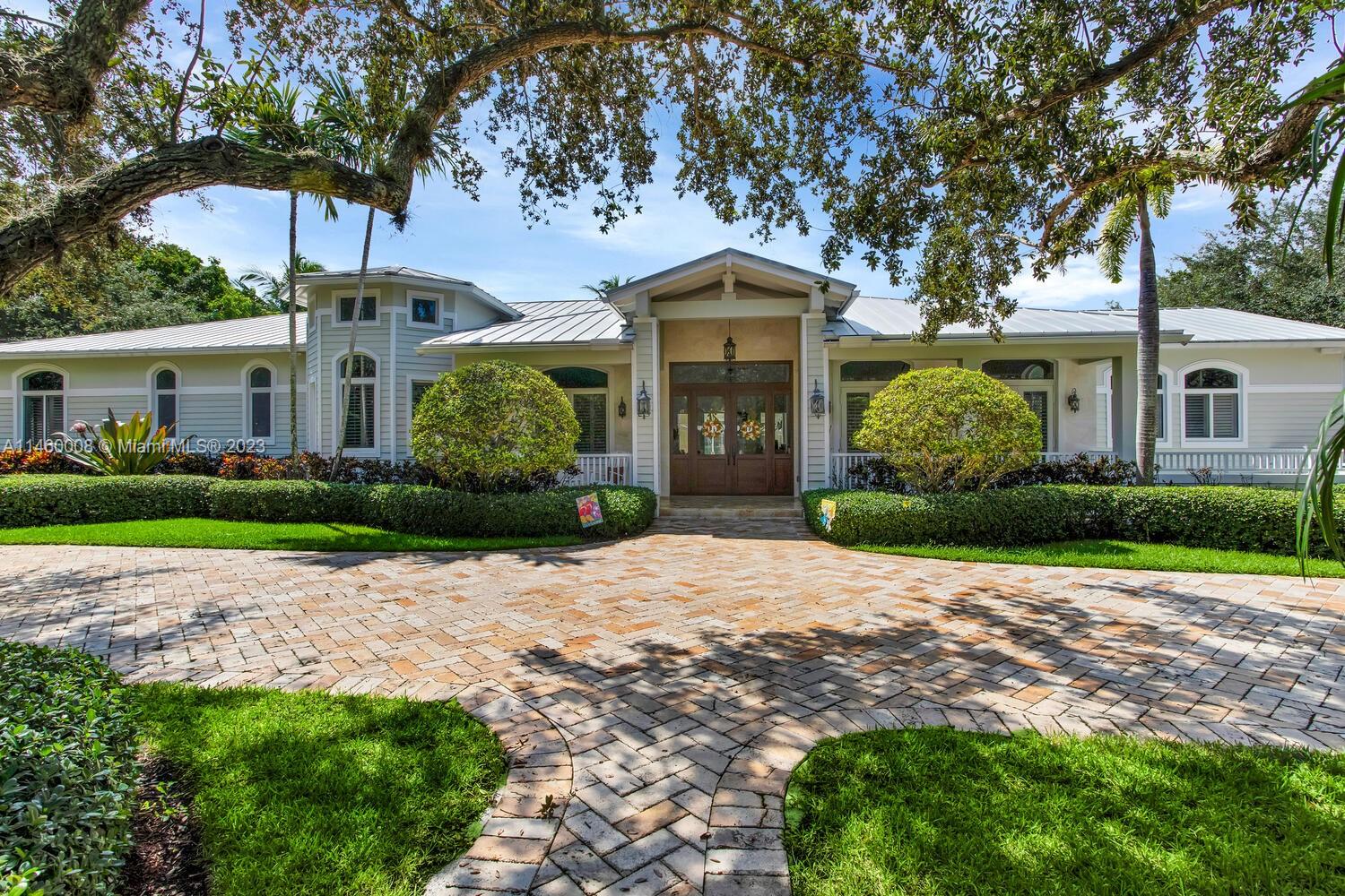 Beautiful Tropical Estate in the heart of Pinecrest.  This spectacular home sits on a fully gated 38,768 sq ft lot and boasts 4 bedrooms, 4 full baths, 1 half bath, Office, Den, Large Bar for entertaining, 1500 sq ft covered terrace, Regulation half-court Basketball court, and a large resort style 40' x 20' pool with jacuzzi. This home was custom built in 2011 and is complete with Metal Roof, Hurricane Impact windows & doors with reinforced sealing for insulation and reduced noise level, and a fully concrete Safe room. 
This home is truly an Entertainer's dream, and the perfect family home! Must See!