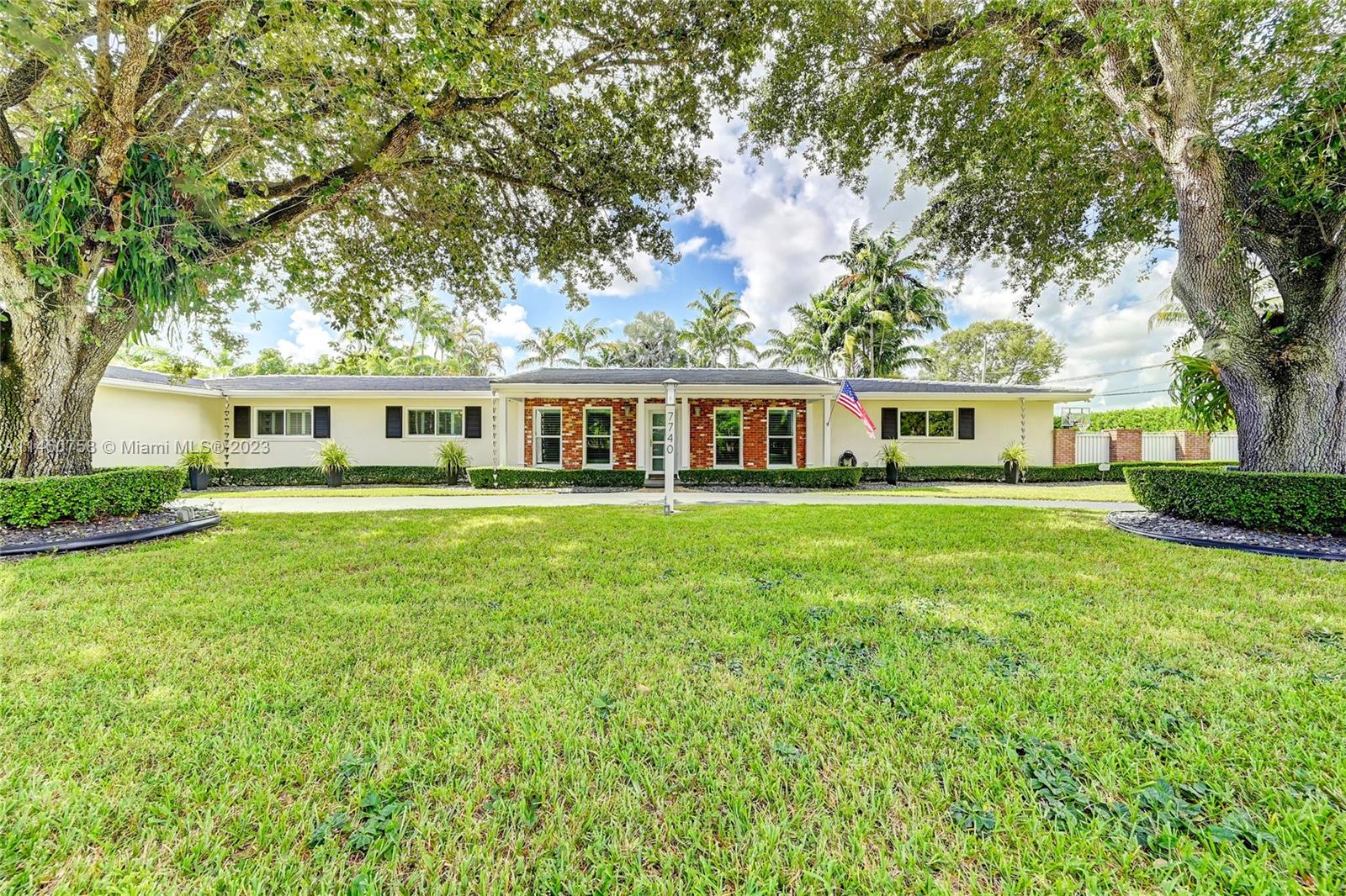 Nestled on nearly an acre in the highly desirable Gables Acres Estates community in Miami, this exquisite pool home has undergone a tasteful renovation with no expense spared. With over 4,000 sq.ft., it offers 4 bedrooms, 4 bathrooms, including a generously sized in-law suite, 2 car garage with built-in wood cabinetry, a custom office overlooking the yard. Equipped with impact windows & doors, plantation shutters, luxurious marble & wood flooring. The island kitchen has been revamped with modern white cabinets, quartz countertops & high-end appliances. A generator that can power the entire house for 2 weeks & a comprehensive security system. Enjoy the pristine pool in a private resort-style oasis, outdoor kitchen, gazebos, composite decking & breathtaking tropical landscaping & lighting.