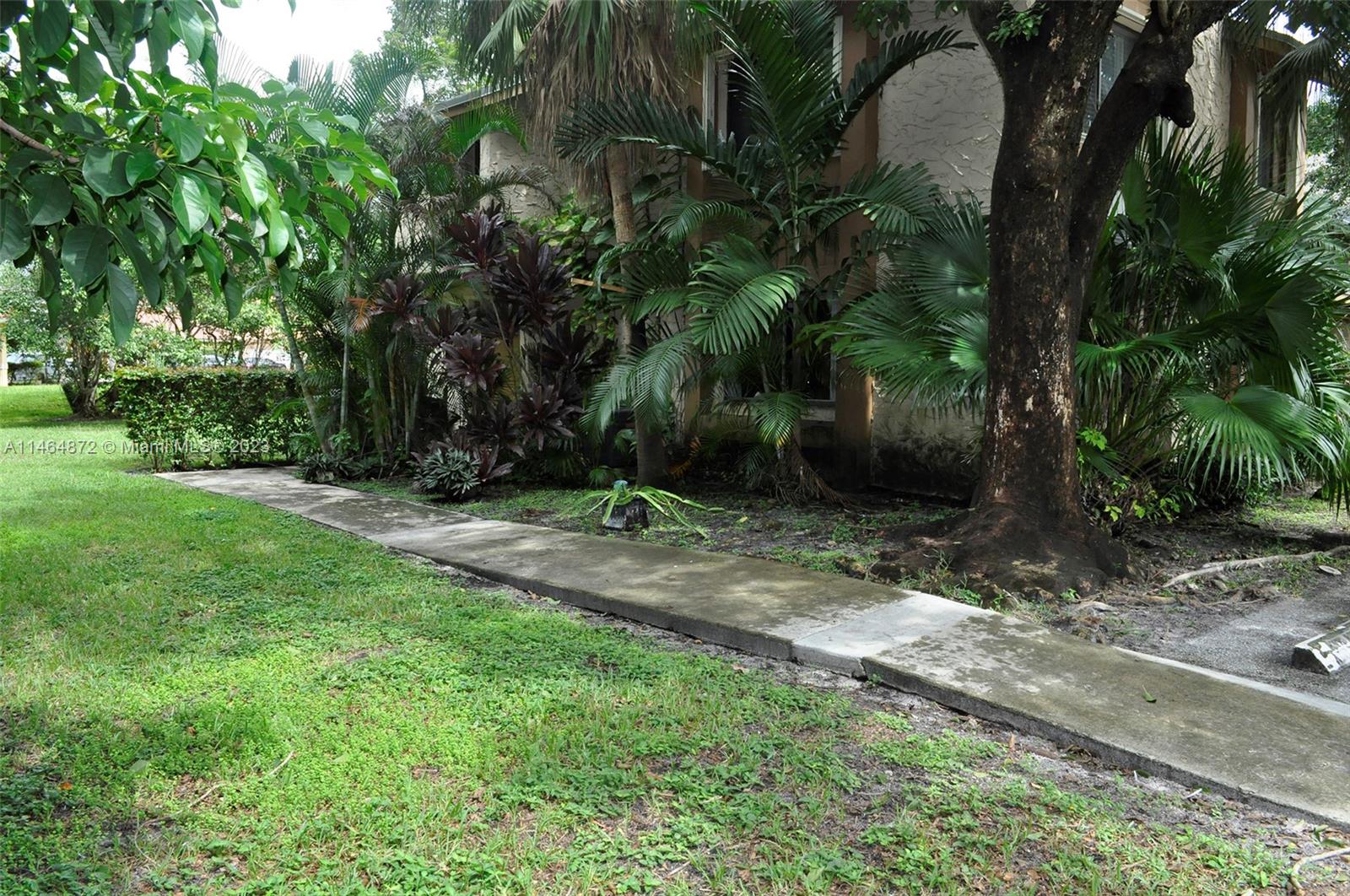 Private second floor corner unit tucked away next to the golf course. Newer updated kitchen with granite countertops, undermount sink and stainless steel appliances. Newer air conditioning (2018), windows (2018), accordion blinds (2018), water heater (2020). Full size washer and dryer in unit and tile flooring throughout. Two assigned parking spaces in front of the house. Pets allowed, one over 25 lbs ok. The community has a swimming pool, playground and tennis courts. Short walk to Central Park. Building has a new roof! (assessment already paid). No rental restrictions. The association does not yet have reserves.