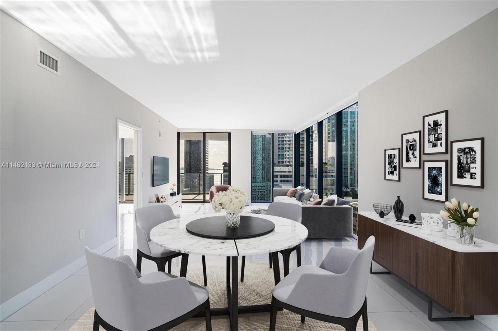 Desired corner unit with views of the Miami skyline and Biscayne Bay.  This spacious 3/3 + den which can be converted into a 4th bedroom, has floor to ceiling windows throughout.  A private elevator takes you directly to your unit.  This luxury building has 2 floors of amenities including a rooftop pool, outdoor theater, squash court, indoor basketball court, a spa featuring a co-ed hammam, a fitness center with a double-height ceiling, an outdoor track, an arcade with a golf simulator, and a host of other fantastic features!  Located in central Brickell you can walk to everything.  2 garage spaces included.