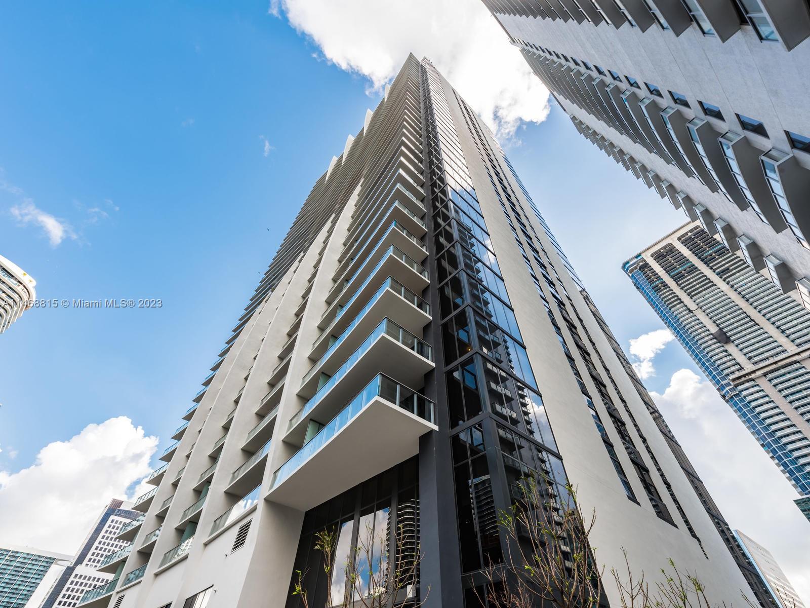 PRIVATE ELEVATOR, TOP-OF-THE LINE APPLIANCES, AND BBQ ON THE BALCONY. THIS AMAZING NORTHEAST CORNER OVERLOOKING BRICKELL AND THE BAY. 3 BED, 3 BATH PLUS BIG DEN OVER 2.100 SQ FT. EXCELLENT CONDITION, TILE FLOOR THROUGHOUT THE ENTIRE PROPERTY. THE BUILDING FEATURES AMENITIES FOR ALL AGES, INCLUDING KID's RECREATION ROOM WITH BOWLING, A VIRTUAL GOLF SIMULATOR, PING PON, SPA WITH COLD AND HOT JACUZZI, MASSAGE AND TREATMENTS ROOMS, SAUNA, STEAM TOOM, GYM, RUNNING TRACK, RACQUETBALL COURTS, SQUASH, PARTY ROOM, INDOOR HEATED POOL, BUSINESS CENTER AND RESTAURANT, SWIMMING POOL ON THE 50th FLOOR ROOT TOP. OUTDOOR MOVIE THEATER, EXCELLENT LOCATION NEXT TO PUBLIC TRANSPORTATION, BRICKELL CITY CENTER, AND RESTAURANTS.