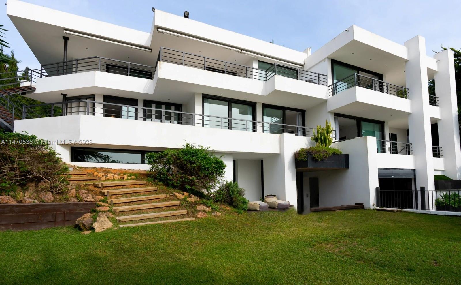This luxury contemporary villa is a grand and stunning showpiece property spread across 3 storeis. Spacious terraces, large rooms, and breathtaking views towards downtown Ibiza, the sea and the countryside are just the start to all this property has to offer. Situated just ten minutes from Ibiza’s town centre, the luxurious villa is open and airy, welcoming in the Mediterranean sunshine from every room. Warm wood floors meet modern steel in the floating staircase that connects the entire villa. Separate living rooms and an expansive al fresco dining area. Indoor-outdoor living is seamless with an expansive rooftop terrace.2 Outdoor pools with decking, sauna, relaxing gardens.Located in the gated community in Can Furnet. Located close to the Golf Club Ibiza and 15 minutes from Ibiza Airport