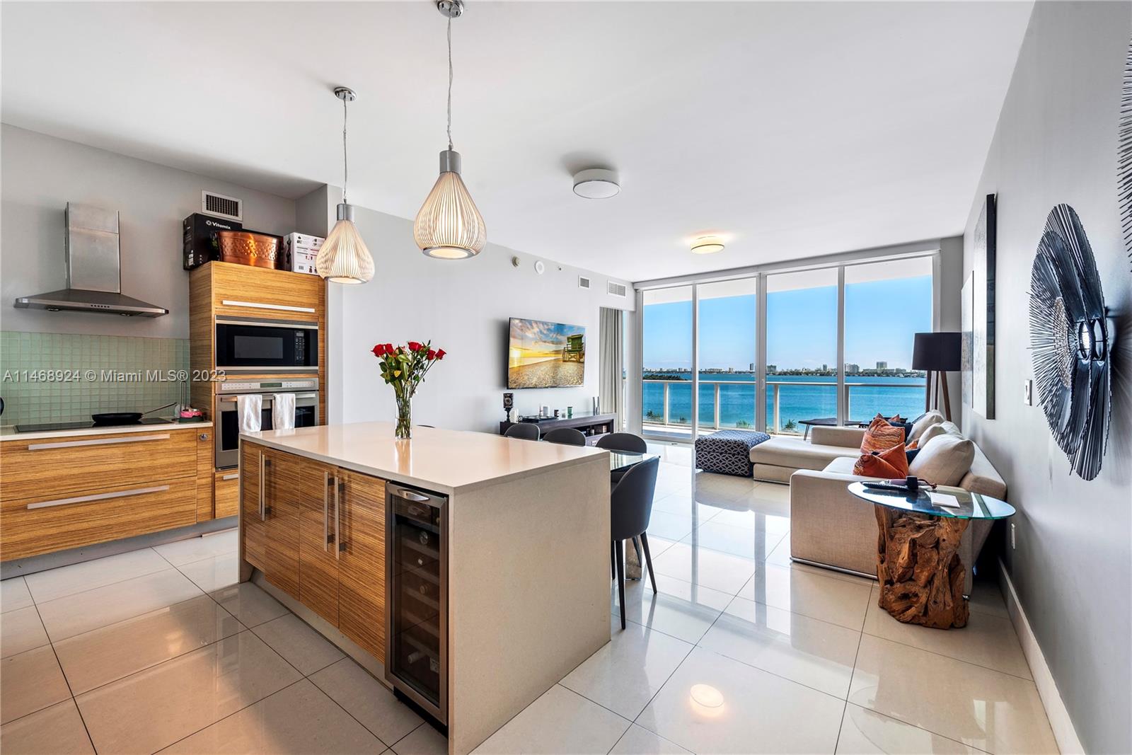 Enjoy Direct Open Bay views from this large 2 bed /2.5 Bath with Den (could be 3 beds). 1,673 sf of interior space , w 2 assigned spaces . Full amenities building , 2 pools, doorman and valet . Fantastic , vibrant , health-conscious neighborhood. Margaret Pace Park across the street with  Tennis , Basketball, and the Ultimate Dog Park. Edgewater is a massively progressive area, walking to multiple restaurants , Adrien Arscht Performing Arts Center , Frost Science Museum and Perez Modern Art Museum.  Minutes to the Airport of South Beach. Easy to show.