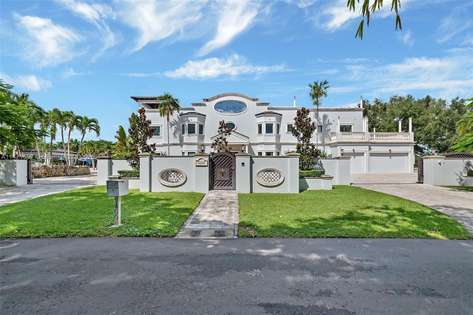 Absolutely stunning! This 9-bedroom, 8-full bath, 2-half bath villa in the heart of Miami is a true masterpiece. paradise awaits, with its saltwater pool, spa, pool cabana, and lush landscaping. The covered back patio with fountain and pond,  and the rooftop terrace with a cabana is perfect for entertaining. The white ceramic tile floors create a bright and welcoming atmosphere, elevator and PGT designer Miami-Dade impact windows and doors throughout. The grand staircase is a showstopper, a laundry room with a chute from the 2nd floor, maids/in-law quarters offers flexibility and privacy for quests. Master is a true sanctuary with its own fireplace 2 spacious custom closets, His/her bathrooms, sinks, and separate tub shower. True luxury living.  SMART HOUSE BY SAVANT.