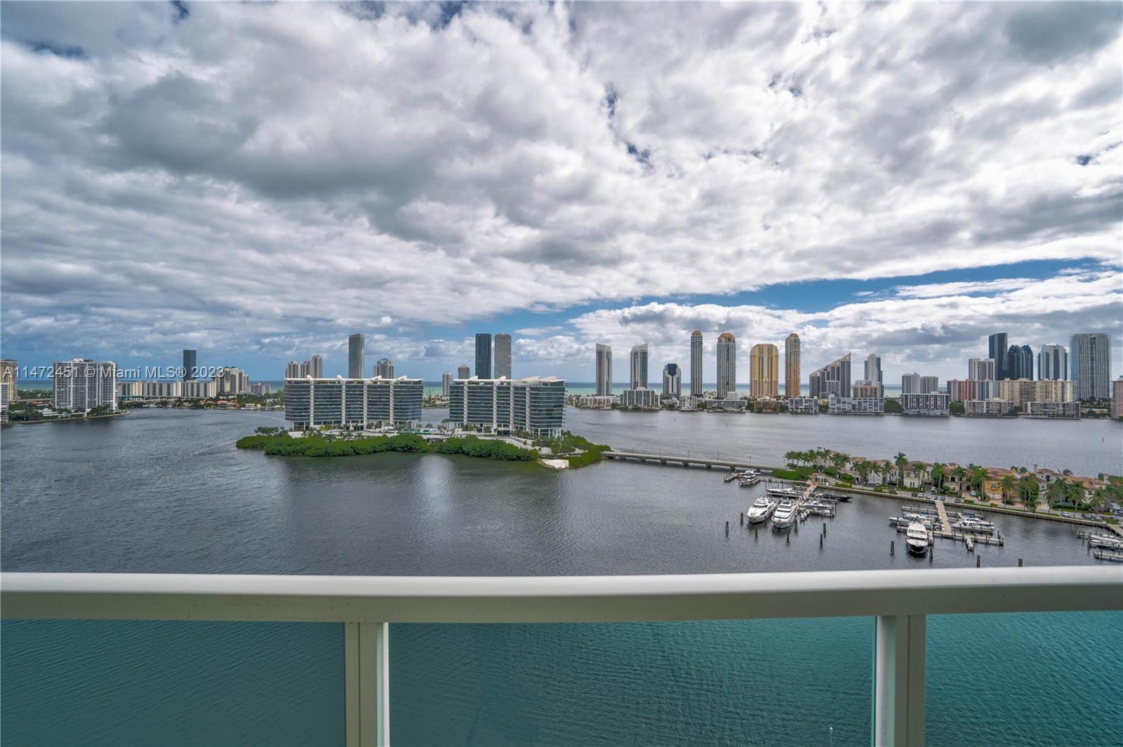 Discover unparalleled luxury living in the heart of Aventura with this chic high-floor residence boasting panoramic Intracoastal, ocean, and skyline views. This sophisticated property features 2 bedrooms plus a den, 3.5 bathrooms, 2 balconies, a private elevator, and 2,970 SF of living space. Enjoy high-end finishes such as impact windows, marble floors, and a gourmet kitchen. The primary suite offers balcony access, Western sunset views, a walk-in closet, and a spacious bathroom. Located in The Peninsula, a luxury full-service building, residents enjoy 24-hour security, concierge services, valet parking, fitness centers, a heated pool, spas, tennis courts, a children's playground, and more. Perfectly situated for easy access to Aventura's amenities, schools, beaches, and dining options.