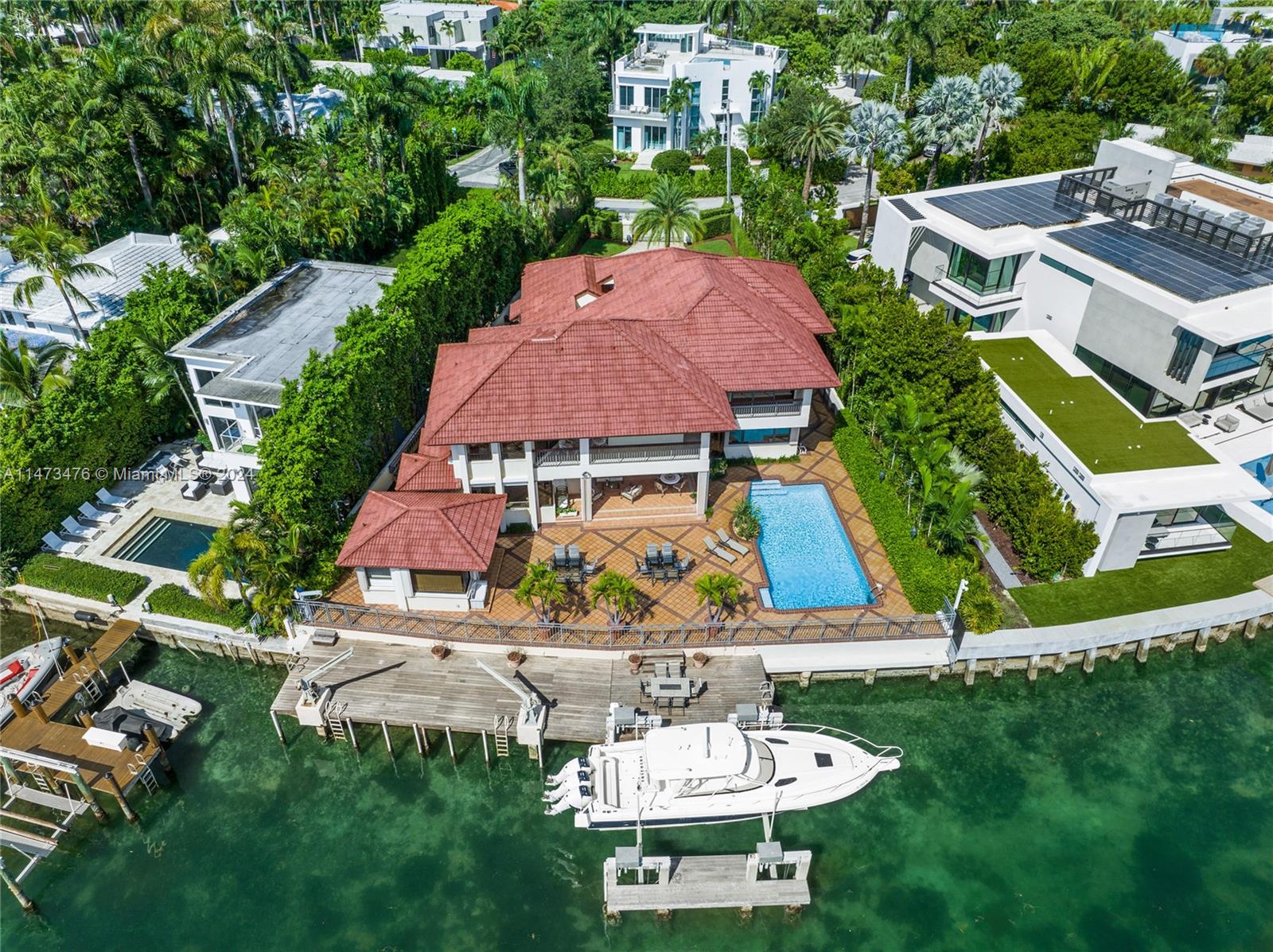 HUGE PRICE REDUCTION! BRING ALL OFFERS! WON'T LAST. AND BRING YOUR TOOTHBRUSH FOR THIS MOVE-IN READY WATERFRONT MANSION! Richly detailed and filled with light, this stunning residence sits adjacent to the clear waters of Biscayne Bay on Miami Beach. Nestled on the Venetian Causeway right in between the City of Miami and South Beach, the location is, well… PERFECT. Get to downtown Miami or South Beach in just a few short minutes.

Featuring six bedrooms and six bathrooms, this home sits on a 12,906 sq. ft. pie-shaped lot that boasts 100 linear feet on the water (note: most waterfront homes located on the Venetian Causeway have only 60 linear feet on the water). The property has a boat elevator lift and two boat davit cranes. BEST DEAL FOR A WATERFRONT HOME ON EXCLUSIVE VENETIAN ISLANDS!