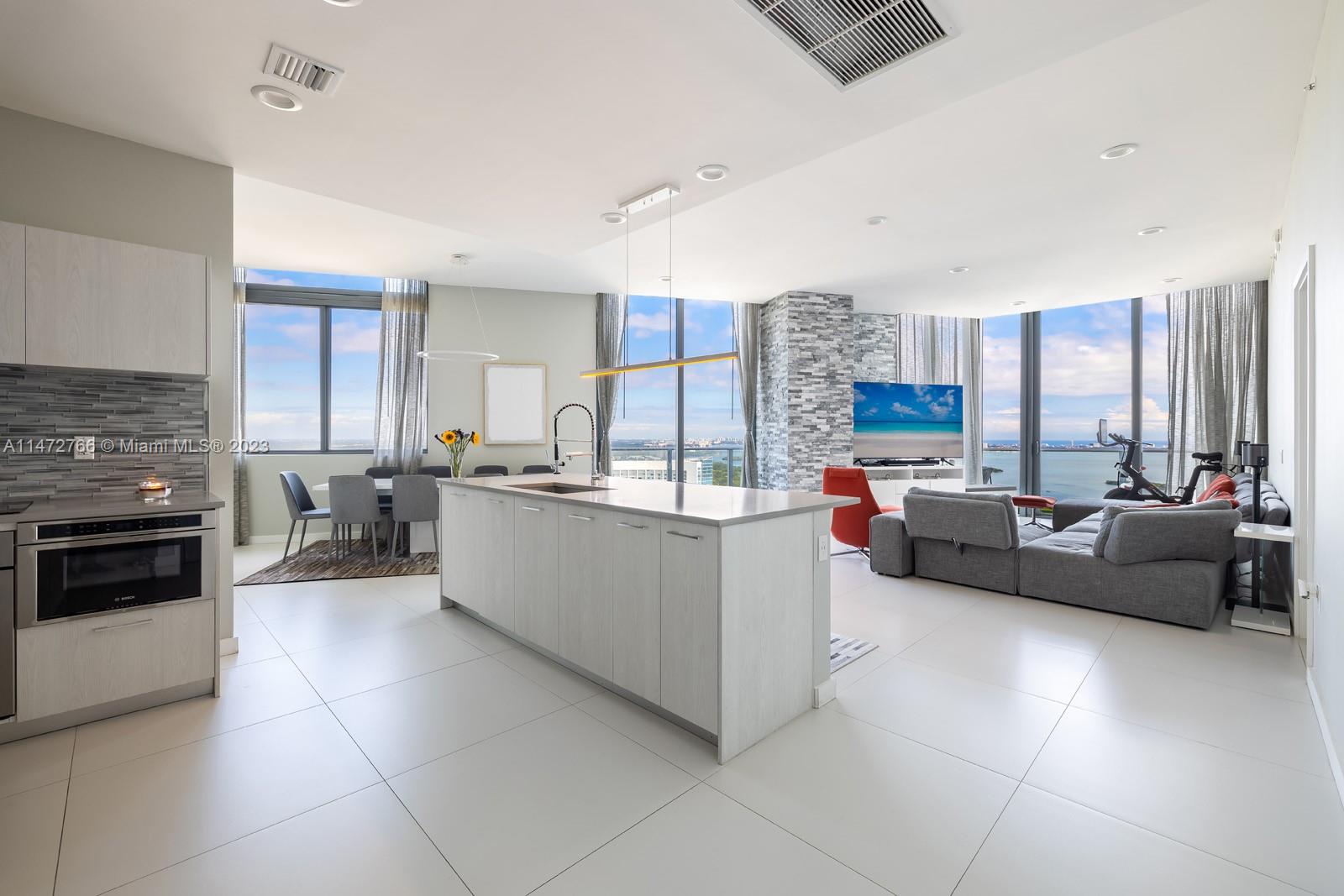 Enjoy breathtaking water views from this Penthouse unit at Paraiso in Edgewater. This 4 BD, 4.5 BA unit features top-of-the-line appliances, a convenient kitchen pantry unlike any other unit, a custom walk-in closet in the primary bedroom, an oversized shoe + coat closet in the entrance, and much more. Resort-style amenities such as gym, full spa, kids playroom, 3,000 sq. ft. party room, tennis, basketball, and racquetball courts, 2 pools (one 75-foot sunset pool with Jacuzzi & BBQ), and 24-hour security. Residents enjoy full access to the Paraiso community park, marina, Michael Schwartz restaurant & Beach Club. 2 parking spots and valet are available 24 hours.