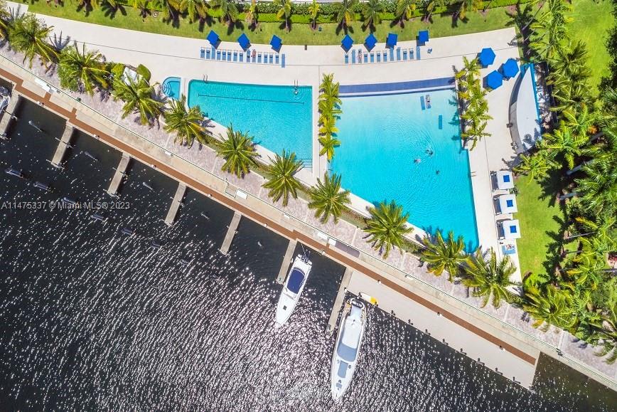 TWO story water views Home available at the luxurious Artech Condominium! Feels like a house in a condo! Modern 2 spacious bedrooms PLUS an additional BEDROOM-DEN CONVERSION (with closet) & 3 full bathrooms. Unit has two assigned spaces plus valet, and a AC storage room. Gaze at the spectacular marina and water view from the kitchen, living area, and master bedroom. Unit offers euro cabinetry with custom pantry, top of the line appliances, wine cooler and quartz countertop. This home has beautiful marble flooring, walk-in custom closets and window treatments. Many amenities such as boardwalk, waterfront pool, fitness center, spa, sauna, movie theater, party room, tennis and racquet-ball courts. Artech Residences is within walking distance of Aces K-8.