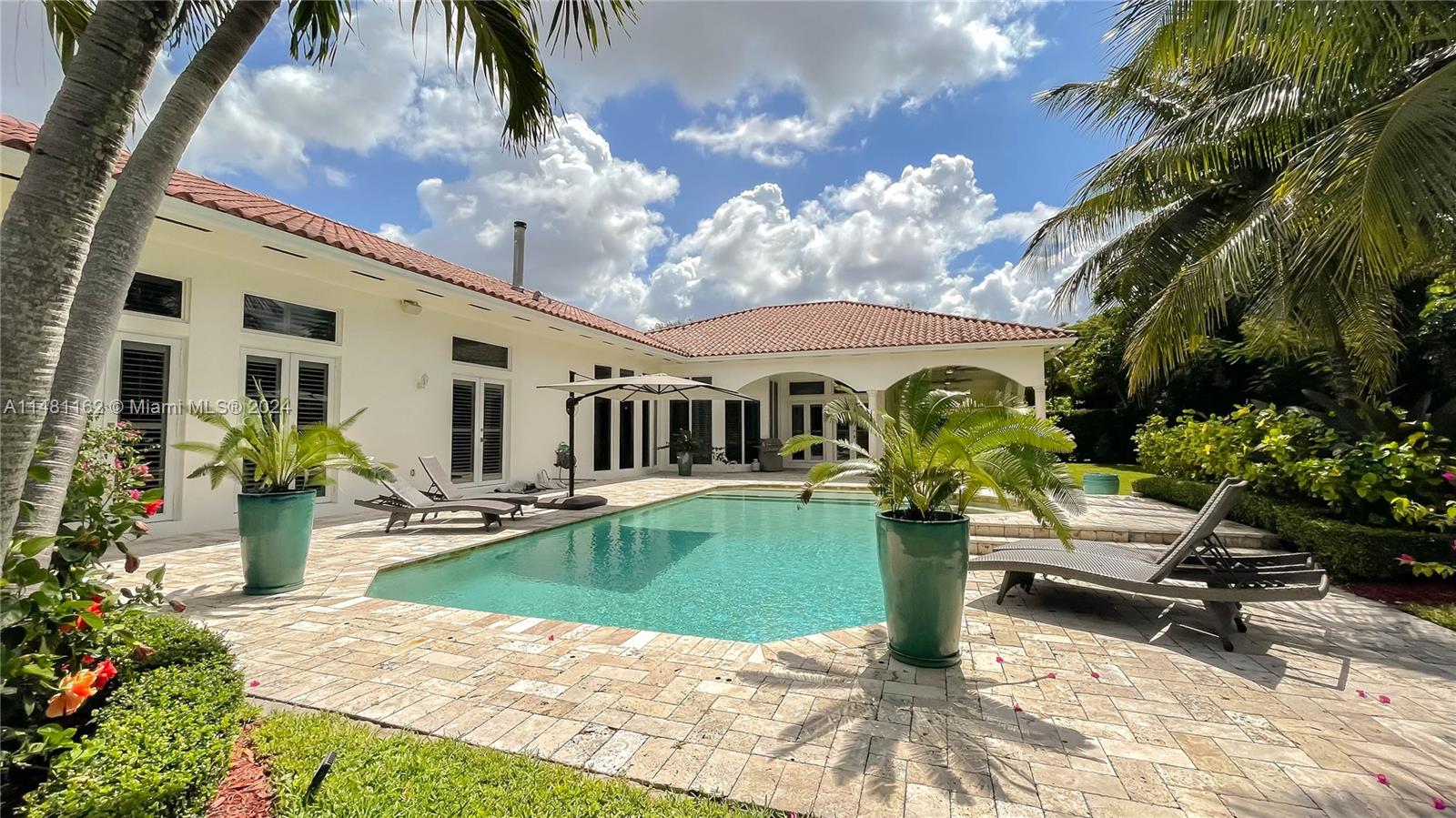 Amazing opportunity to own this beautiful one story Mediterranean style home located in the desirable area of North Pinecrest. This home features an elegant and bright great room with working fireplace, wet bar equipped with wine cooler & ice marker.  Marble floors throughout, 5 bedrooms & 4 bathrooms.  Amazing high ceilings with surround system throughout. The gourmet kitchen offers plenty of space & opens to family room and breakfast area, in addition to offering a formal dinning room. Impact windows & doors, multiple sets of french doors throughout the home that opens to the tranquile outdoor space, perfect for entertaining.  Close to major highways, great shopping and restaurants in South Miami and Dadeland Mall. Excellent top Pinecrest public and private schools are all closed by.