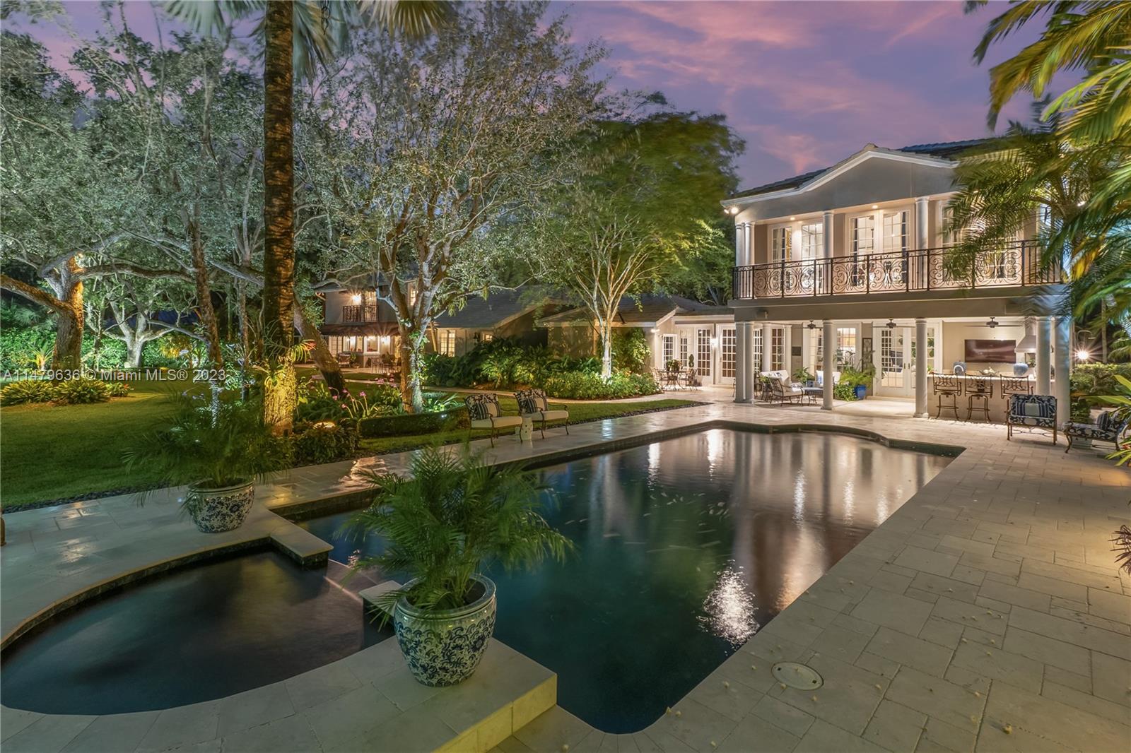 Spectacular and Striking! A montage piece of Paradise to Call home! An extraordinary & elegant family compound sits on extra large oak laden lot with tropical plantings, adjacent to the lush palmetto reserve of greens! Utterly distinctive & gorgeous design through a cohesive blend of designer finishes decor & a curated fabulous flow of  floor plan. Stunning soaring ceilings, opulent formal living and dining rooms. Lavish master suites with sumptuous baths (2 masters on east and west wing) This updated timeless & classic masterpiece transcends with ultra-luxurious living  w/all modern comforts! Additional media room & gym. A gourmet summer kitchen. The heavenly outdoor park-like setting w/inviting pool, pergola. Amazing grounds & plantings set like a dream wedding venue! Over 6000SF luxury!