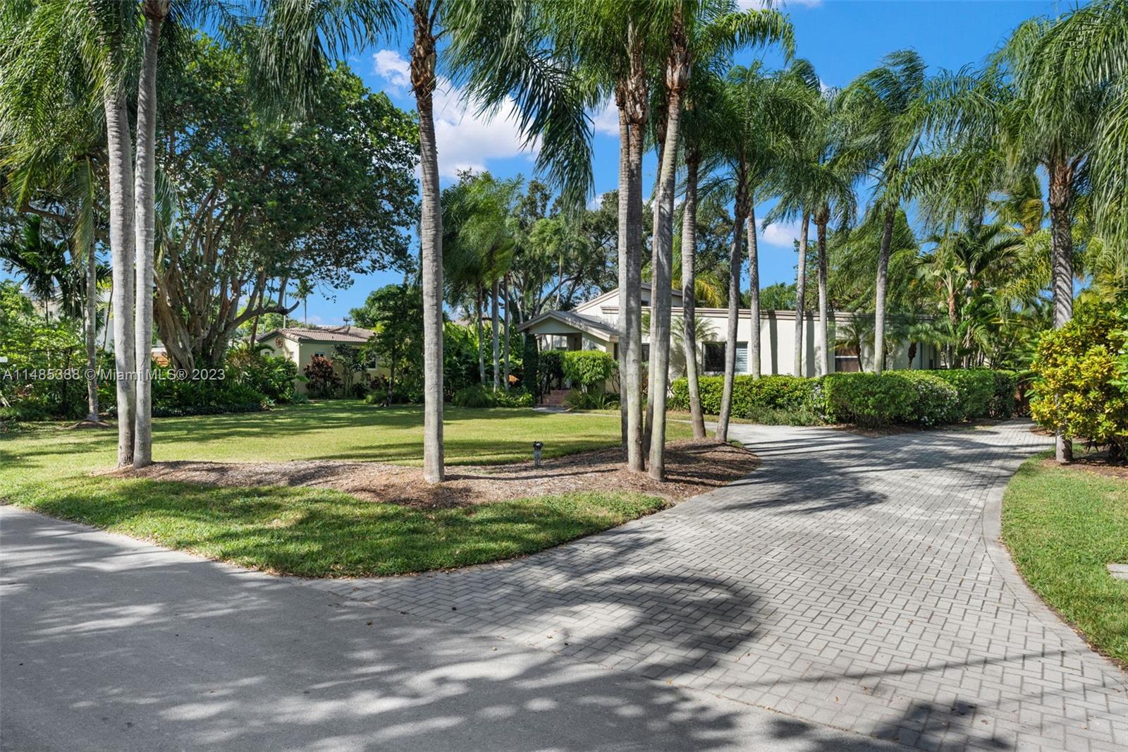 Nestled on sprawling, ultra-coveted oversized 18,300 sq. ft. lot (100' X 183') in exclusive South Miami neighborhood sits fantastic family home ready for next chapter or build dream home. Surrounded by new construction homes, this private dead-end street with no through traffic and no flood zone is ideal. Property features 2,504 sq. ft. under A/C: main house (4 bed/2 bath) & guest house (1 bed/1 bath, full kitchen, living room, dining area). Great floor plan with master suite wing, impact windows/doors & oak floors. Rare sewer connection available and underground powerlines. Minutes from Miami's top public/private schools, and walk to best restaurants/shopping in South Miami plus centrally located to Coral Gables/Brickell.  Truly amazing opportunity to make your own!