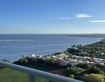 Magazine worthy renovation in this Coconut Grove dream condo. Views of the glistening Blue waters of Biscayne Bay and sunsets that are mesmerizing. Located in full service resort style hotel condo. No Rental restrictions affords the owner many options for rentals or private residence.Upgraded high impact floor to ceiling doors, electric shades including black outs,new kitchen with marble counters Bath with Huge spa like  shower ,wood floors,custom italian interior doors,primary walk in closet professionally racked out for maximum storage, office nook,nest thermostats, creative Stroage throughout. Possible to convert to a 2 key unit.