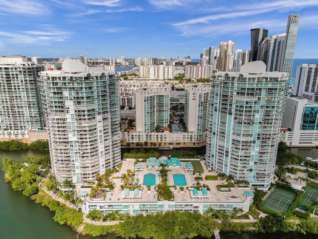 This Oceania Tower IV in Sunny isles beach residence is offering a luxurious lifestyle with its corner unit featuring 3 bedrooms, 3 bathrooms, and stunning views of the ocean, intracoastal, and city, Downton Miami skyline. The wrap-around balcony adds to the allure, and the interior boasts marble floors in living areas and a cozy touch with bedroom carpets. The amenities, including restaurant, tennis, racquetball, beach service, pool, gym, spa, fitness center, fitness classes, social activities marina and more, contribute to a resort-like experience. Security, concierge and valet 24 hours. 
Its convenient location near Bal Harbour shops and Aventura Mall enhances its appeal.