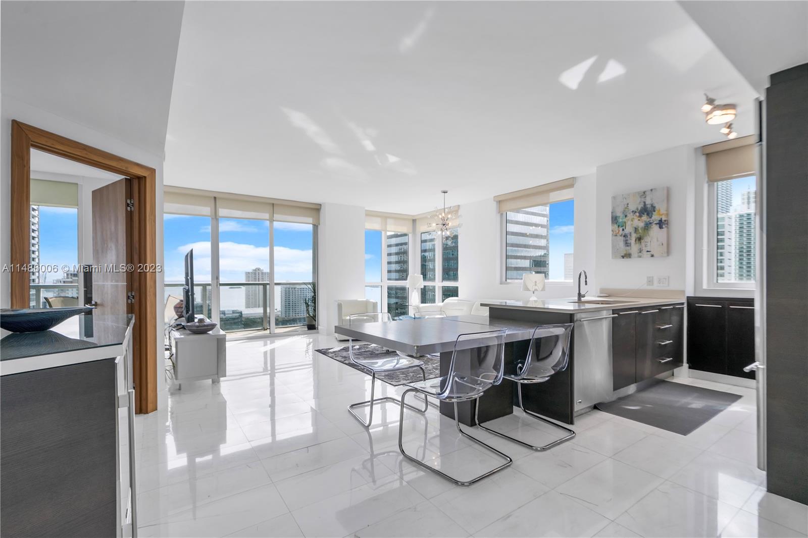 Introducing a luxurious 2/2 condo in the heart of Brickell Ave, boasting unparalleled elegance & breathtaking views. This sun-drenched haven features floor-to-ceiling windows showcasing stunning vistas of the bay & ocean horizon.
The residence comes replete modern finishes & exquisite amenities, including a captivating rooftop pool adorned with day beds overlooking the city's skyline. Additionally, a 11th-floor pool with cabanas, a chic lounge area, & a cutting-edge private gym. Convenience meets sophistication with valet services, EV charging stations, a spa for both him & her, ensuring a pampering experience. Don't miss this opportunity to own a slice of paradise harmonizing panoramic views, lavish amenities, & an unbeatable location in the heart of Brickell Ave's finest offerings.
