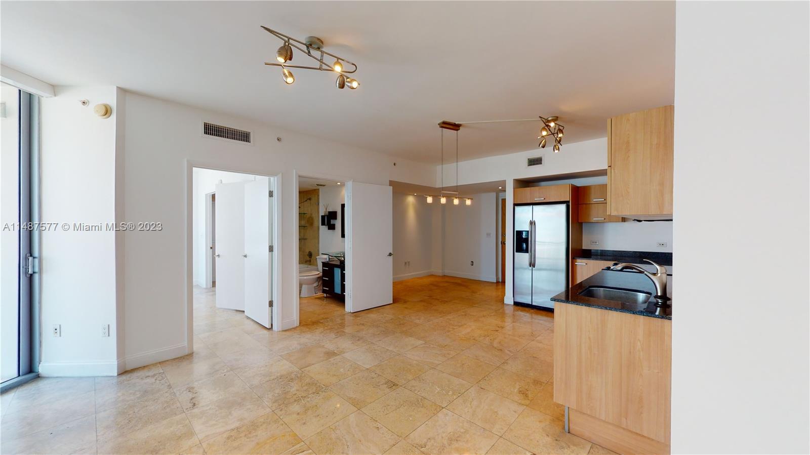Largest 1 bed 1 bath, Beautiful unit with European kitchen, granite countertop, stainless steel appliances, marble floors throughout, large balcony. Smart Thermostat, remote-controlled Ceiling fan, Walking distance to Metromover, Brickell city center, Brickell financial district, and Merry Brickell Village. Building amenities include 24-hour concierge service, steam, sauna, and massage rooms, racquetball court, state of the art 2-story gym, infinity-edge pool, hot tub, billiards, spectacular 2 level Event and Party lounge overlooking the Miami River and Downtown Brickell, Business center with conference area, Children's room, Valet Parking, and more much more. Water, Cable, and Internet included. Living room flat TV included in the listing. 1 assigned parking.