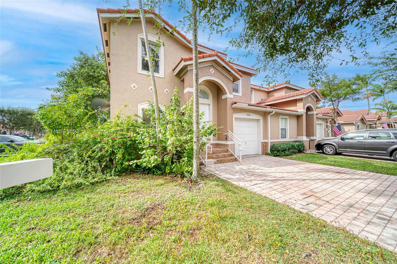 Spacious Mediterranean Corner lot home boasting 4 Bedroom 2 ½ bathroom, pavers driveway with a one car garage.  Brand new remodeled kitchen with quarts countertop and new stainless-steel appliances.  Unit has brand new washer & dryer.  Tile throughout the first floor and brand new high-end waterproof laminate on stairs and 2nd floor.  Abundant storage & closet space. Freshly painted. Great yard for entertaining.  Plenty of guest parking. The community has a pool and clubhouse.  Gated entrance with security.  Close to great schools, entertainment and access to all expressways.  Low HOA, easy approval process.