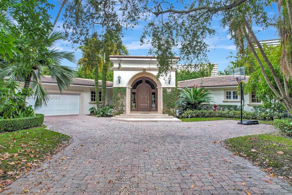 Rare opportunity to live in the exclusive guard gated Bal Harbour Village on an oversized (17,500 sq. ft.) cul-de-sac lot situated in A+ location with a rare unobstructed garden view, steps from the Bal Harbour shops pedestrian entrance and 96th St "side gate". This charming single story Mediterranean home was originally redone by renowned architect Barry Sugarman. Featuring an expansive master suite with an office/gym area, exquisite master bathroom, spacious closet space, skylights adding extra natural light, bar in dining room, media room, cabana bath and a converted garage with 2/ 2 bath maids quarters. Outdoor space includes an extra large backyard with a garden, sitting area and a large pool.