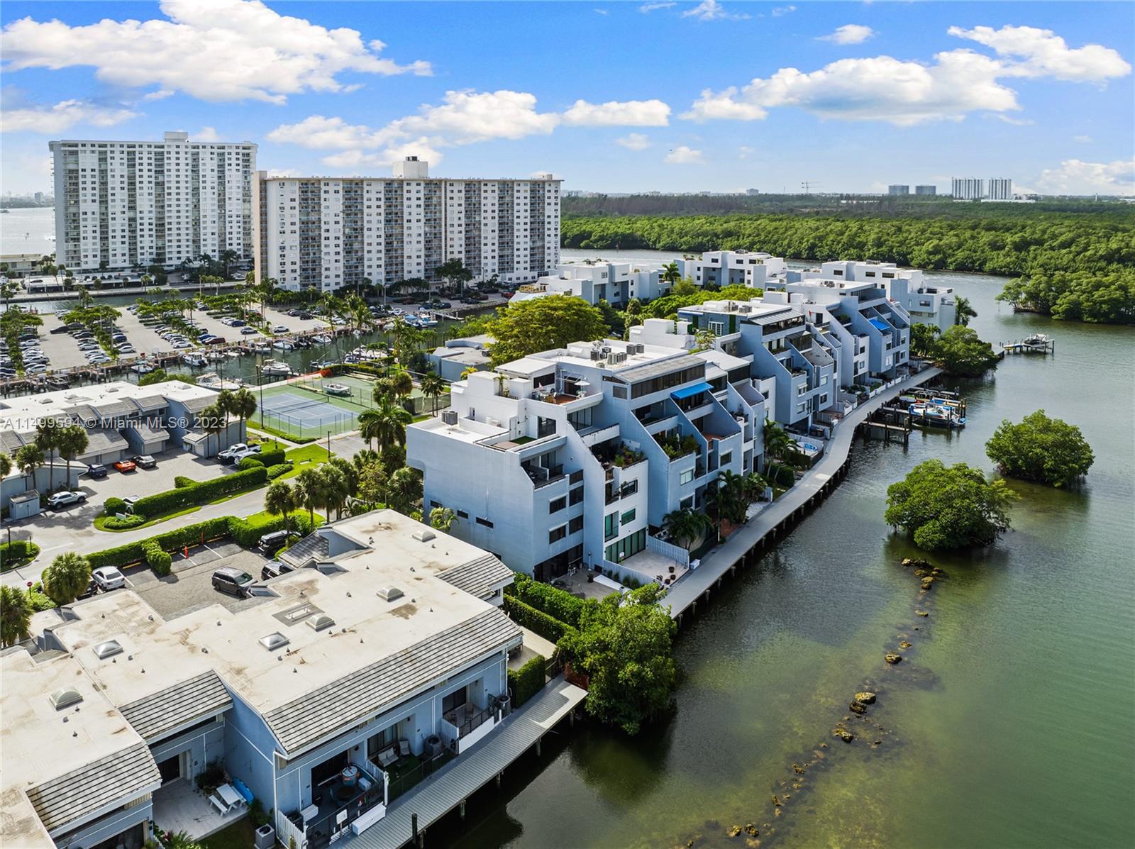 This upscale 3-bed, 3.5-bath condo in Sunny Isles at Poinciana Island Drive offers a sophisticated living experience with a recent full remodel. Seamlessly blending kitchen, living, and dining areas, the residence presents a harmonious design. From its windows, relish spectacular views of the bay, canal, and the city of Sunny Isles. Sunsets cast warm hues, creating a serene ambiance. Though structures may obscure the sunrise, the interior basks in the unmatched glow of sunset. Adding allure, the condo features three integrated terraces, where one hosts a relaxing jacuzzi. Situated on a private island, residents enjoy tranquility and privacy, surrounded by natural beauty and high-end amenities. This space, with terraces and jacuzzi, epitomizes luxury living in Sunny Isles.