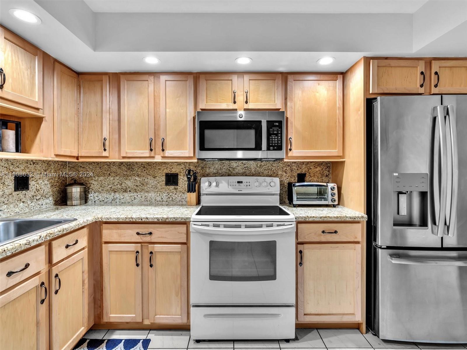 UPDATED KITCHEN IS SPACIOUS AND FUNCTIONAL