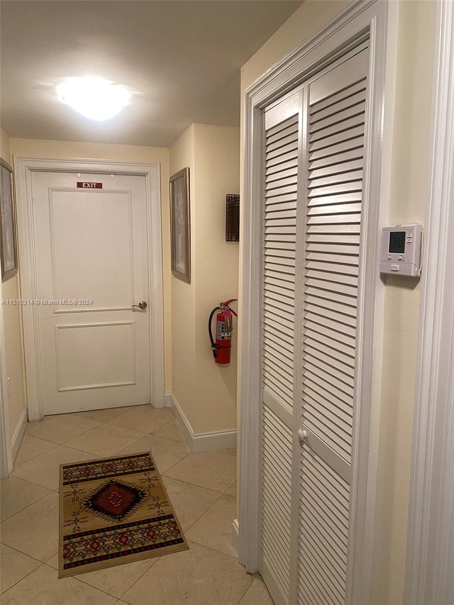Hallway with bifold door to air handler
