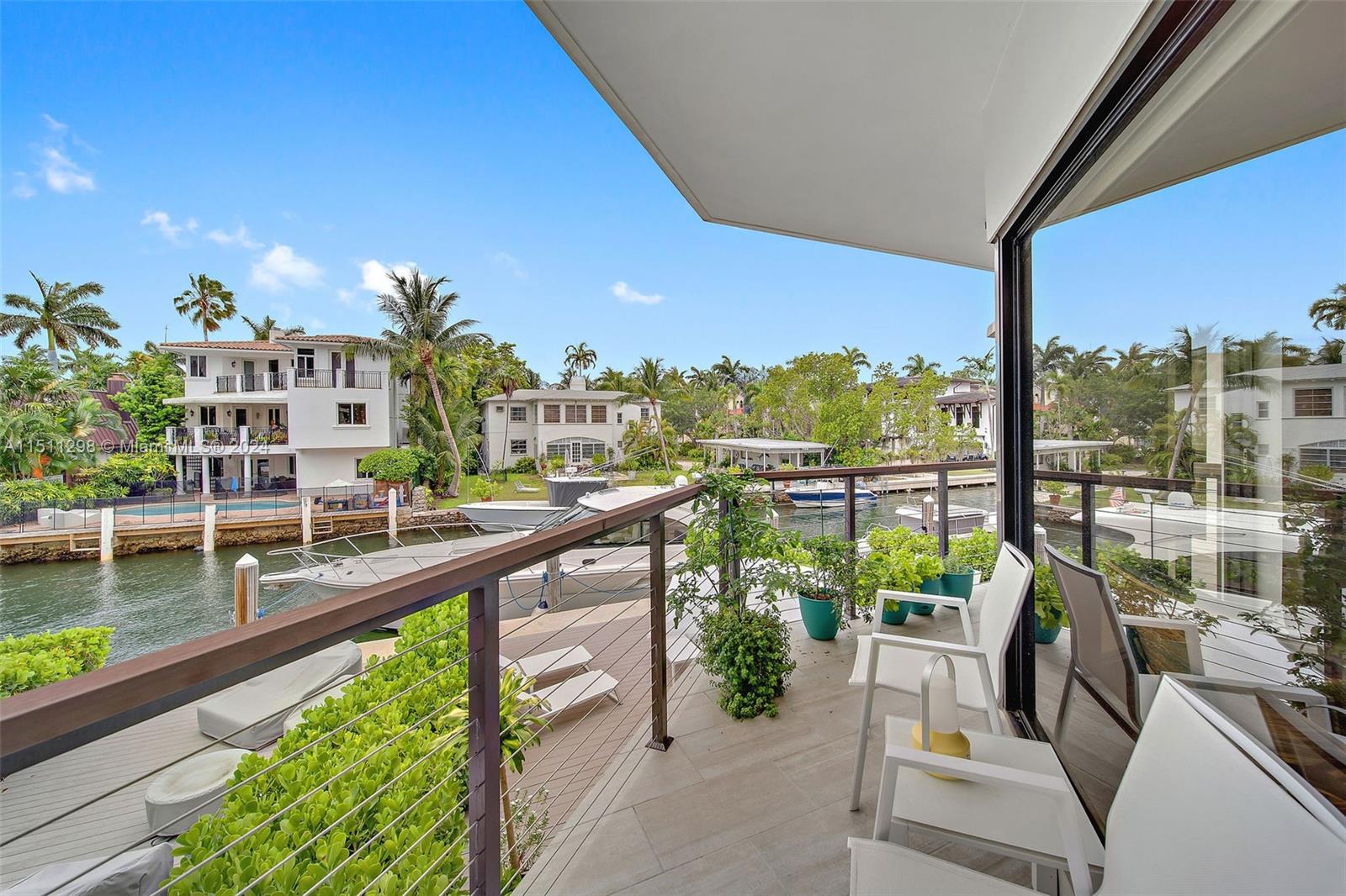Captivating waterfront townhome in prestigious North Coconut Grove. Located in an ultra-private, recently updated gated community of 8 residences. Light-filled living spaces w/ a modern vibe & walls of glass that open to covered balconies for enjoying bay breezes. Updates include impact glass, smart home features & spa-like baths. 1st level flex space can convert to 3rd BR. Sleek, European-style kitchen offers quartz countertops, stainless appliances & breakfast bar. Stunning primary suite w/ vaulted wood ceilings & balcony with water views. Experience idyllic outdoor living on the expansive private deck overlooking your own 40’ boat slip w/ no bridges to the bay & ocean. Just minutes to downtown, Brickell, Key Biscayne and to world-class shopping & dining in the historic Grove village.