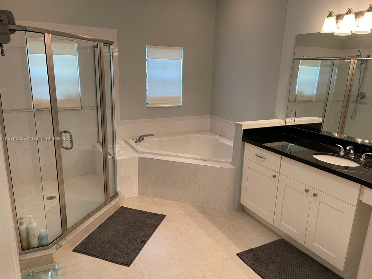 Main bathroom features separate shower and tub.