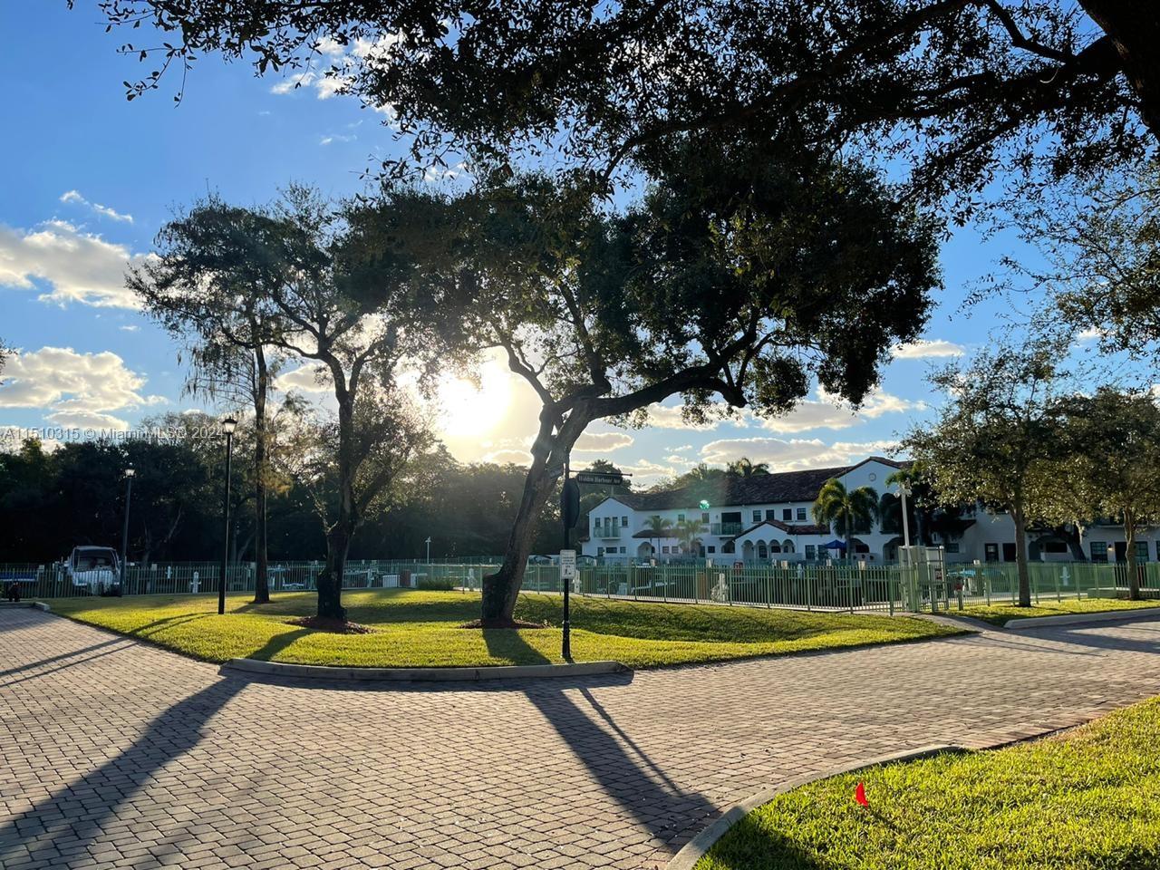 View from the driveway towards the pool to the left side.