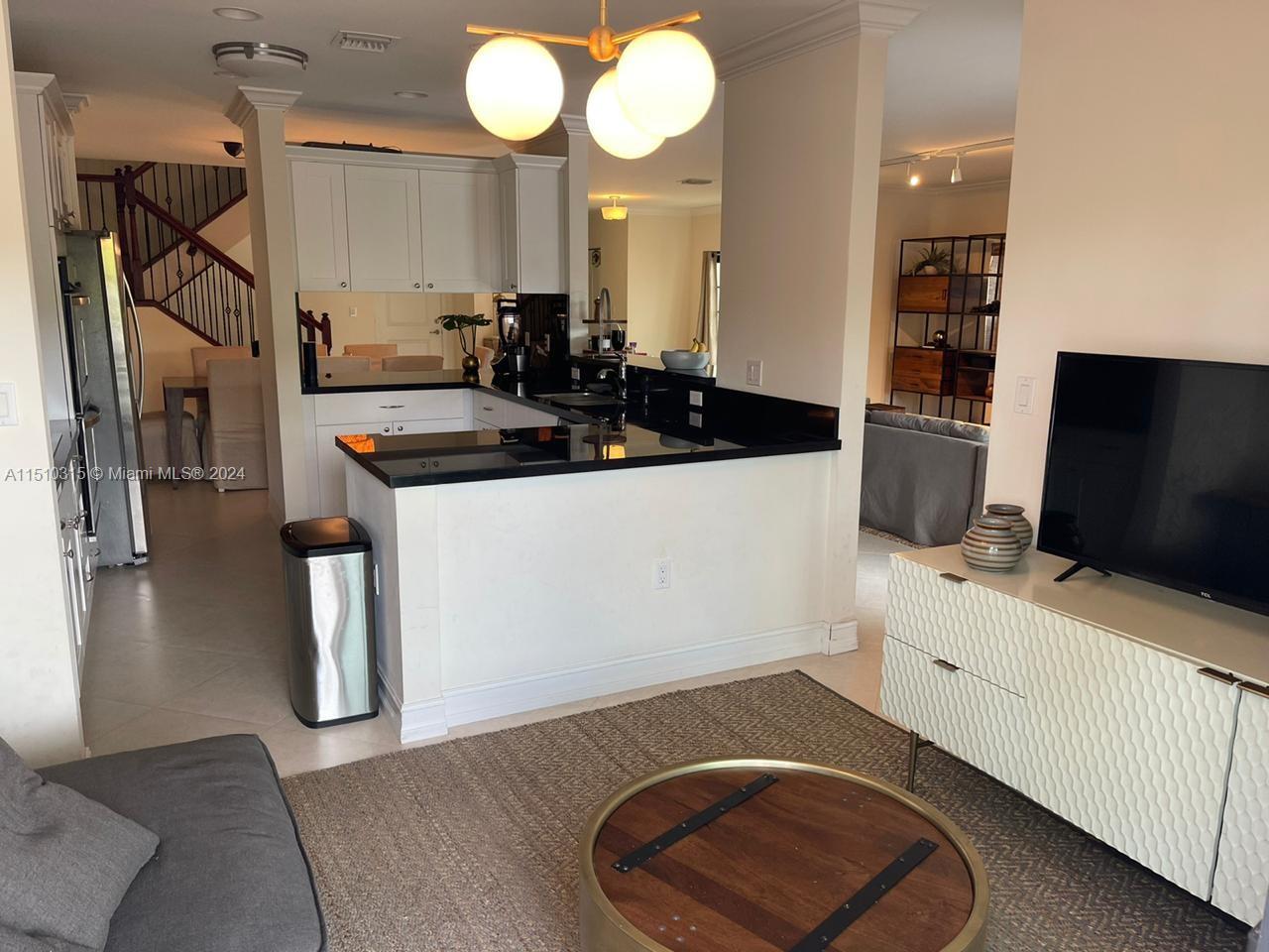 Breakfast or TV area looking towards the kitchen.
