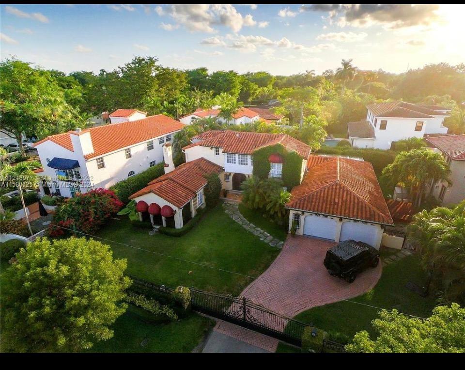 Discover a timeless treasure in this 1926 2-story Spanish-style home, Boasting 4 bedrooms, 4.5 baths. The gated property offers a heated saltwater pool, porch, and pergola—perfect for entertaining. Modern amenities include an open kitchen with stainless steel appliances and a new roof. Embrace family moments in the spacious family room. Situated in Coral Gables, close to the University of Miami and Miracle Mile, this residence blends historic charm with contemporary living, creating a haven in a vibrant community. The first floor features a master suite, Tv room, family room with an elegant fireplace and beam ceiling adding character and warmth to the interior. Second floor has been completely remodeled keeping its original wood floors! A gem you cant miss.