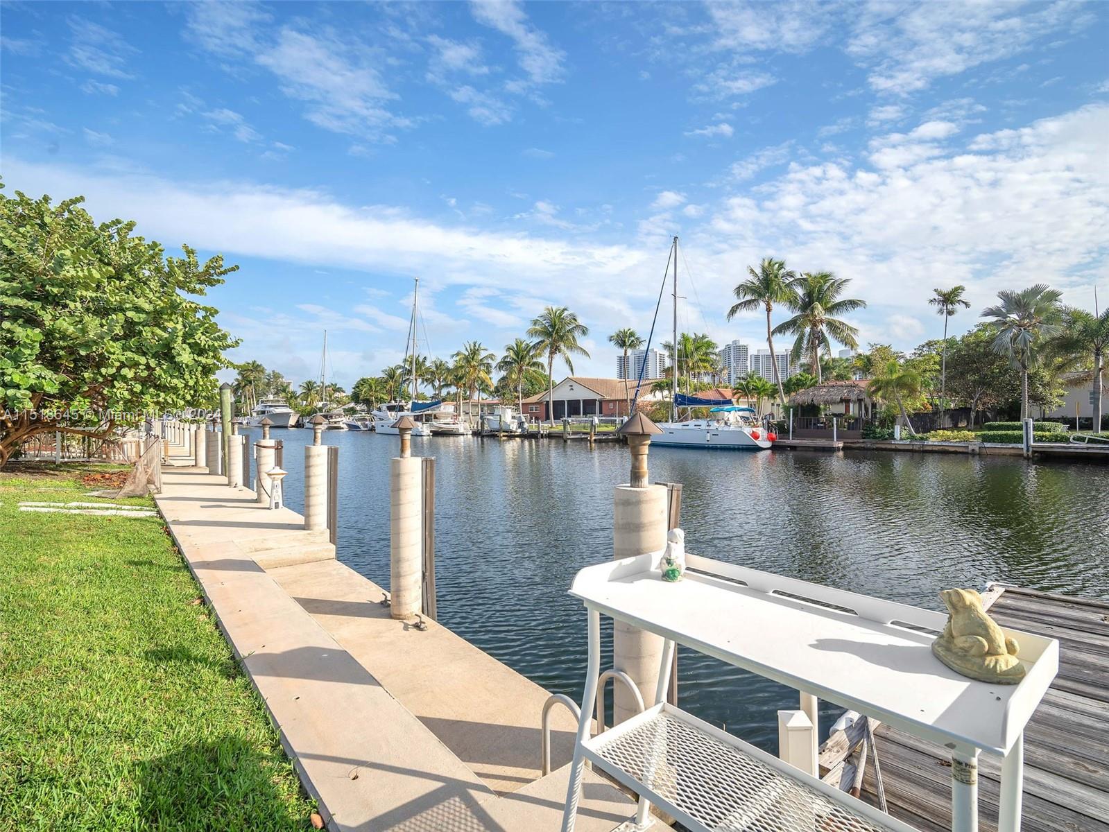 Nestled in the prestigious Golden Isles Estates, this 4/3 waterfront haven offers a taste of luxury living. Centrally located between Miami and Fort Lauderdale, enjoy proximity to beaches, restaurants, shops, and entertainment.
On a 12,750 sqft lot, with 85 ft of deep water frontage, this residence promises swift access (30 min) to the open ocean, free from fixed bridges. The concrete dock, lit for convenience, features 50 amp, 30 amp, 110v outlet, and sturdy cleats with "FEND ALL" bumpers. The 120' wide canal accommodates large yachts. A cleaning table at the dock's west end and an 8’X20’ floating dock enhance waterfront living. Surrounded by new 2-story homes, seize the opportunity to build your dream home in this prime location. Elevate your lifestyle in this luxurious Florida retreat!