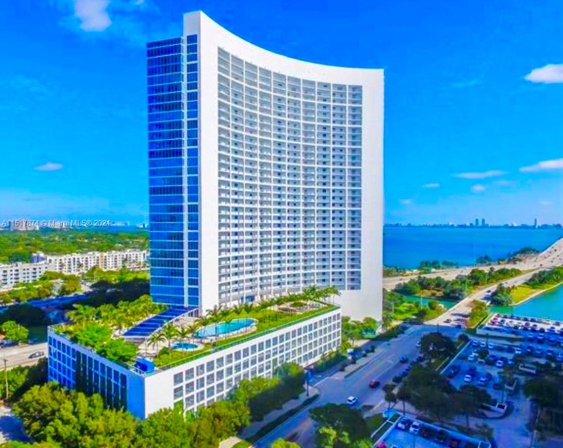 FULLY FURNISHED,Unobstructed True Million Dollar views of Biscayne Bay/Ocean. Cozy 1Bed, 1.5 Bath, fully updated unit at the Blue Condominium. New kitchen appliances cooktop and microwave, new washer/dryer, 1 parking, 1 storage, Elegant white ceramic floors, floor-to-ceiling windows, granite countertop, a private elevator serving only three units per floor and it is pet-friendly. Resort-style living awaits with 2 pools, hot tubs, a movie theater, top-tier gym, sauna, steam room, playrooms, game room, business center, 24/7 concierge, and more. Conveniently located near Design District, Midtown. 5Mi to Miami Beach, 8Mi to MIA airport, 4Mi to Brickell, Mount Sinai Hospital. In excellent condition and ready-to-move-in with only your personal items, this apartment is an exceptional opportunity