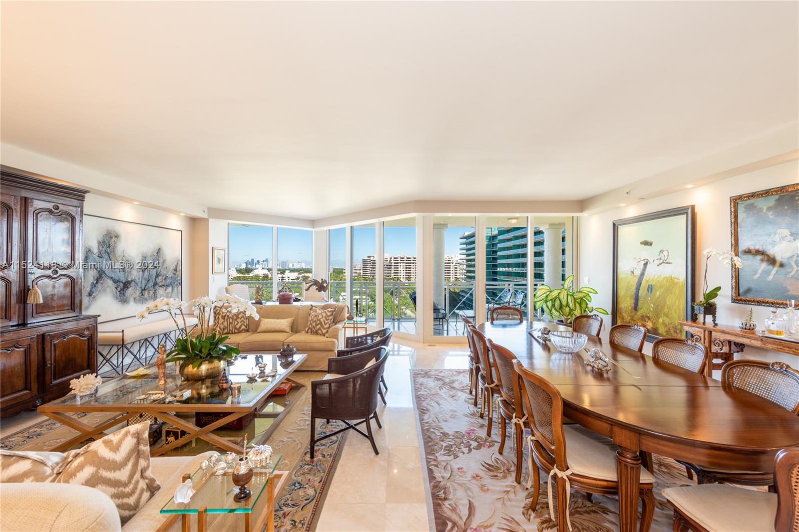 Experience classic elegance with breathtaking Miami skyline views in this exquisite residence at the Grand Bay Towers, located on the gated grounds of The Ritz-Carlton Key Biscayne. Nicely remodeled & meticulously maintained, this move-in-ready home is ideal for a large family, offering 3 bedrooms plus den, each with its own bathroom, a spacious 2,950 SF layout. The private elevator, chef-style kitchen, oversized master suite & covered terrace for al fresco dining all enhance the luxury feel. Enjoy the recently renovated lobby & resort-style amenities, including tennis courts, beach access, pool, valet, & lush tropical grounds.It's upscale island living just a short drive from the vibrant scene on Brickell, Coconut Grove, & Miami Beach.Live the epitome of luxury in this stunning residence.
