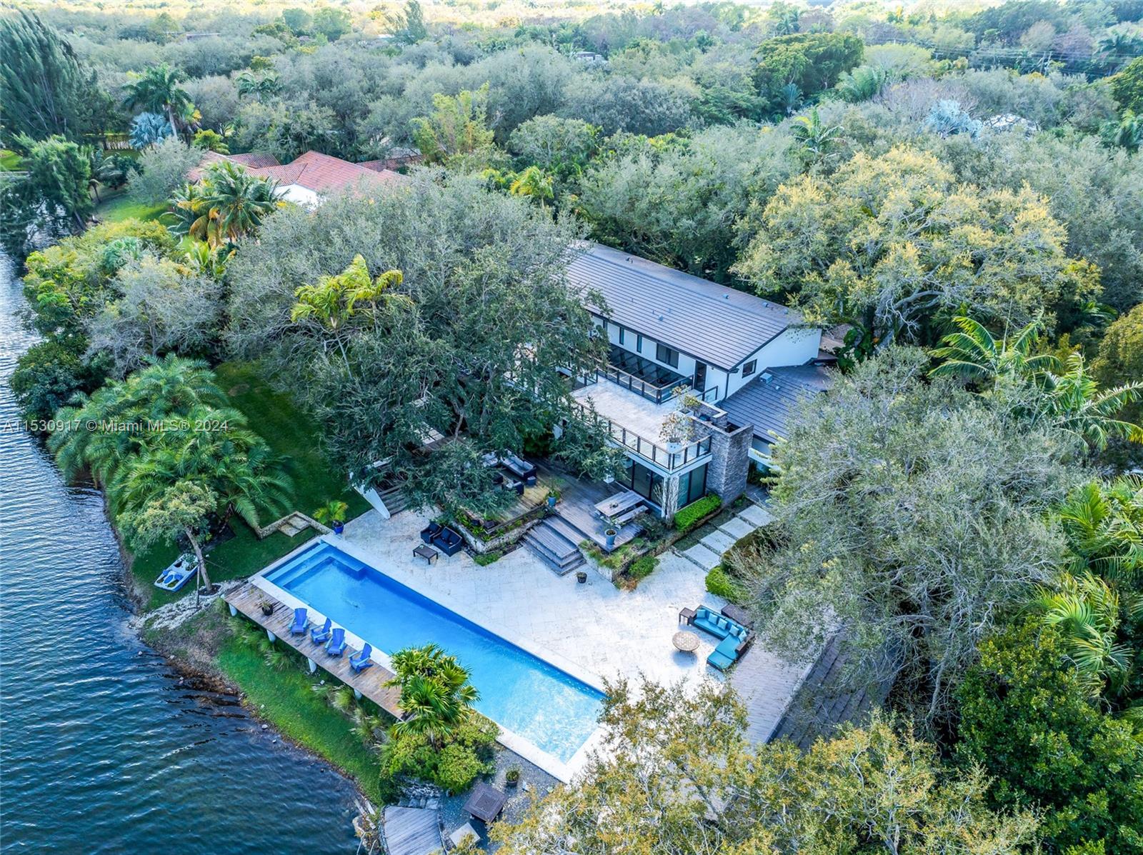 Nestled within the prestigious gated community of Snapper Creek in Coral Gables, this magnificent Home estate exemplifies the epitome of luxury living. Boasting timeless elegance and an array of upscale features and high end finishes, this residence offers a rare opportunity for those seeking the pinnacle of South Florida with 24/7 security ensures tranquility and privacy overlooking the lake. A chef's dream the kitchen dazzles with top-tier appliances, custom cabinetry, and a central island.The master bedroom retreat indulges with large balcony, spa-like ensuite, and abundant closet space.Multiple living areas with stunning skyline and natural light . Exceptional Entertaining-spaces with sauna and outdoor gourmet area. Access to a private Marina with a full time dock-master.