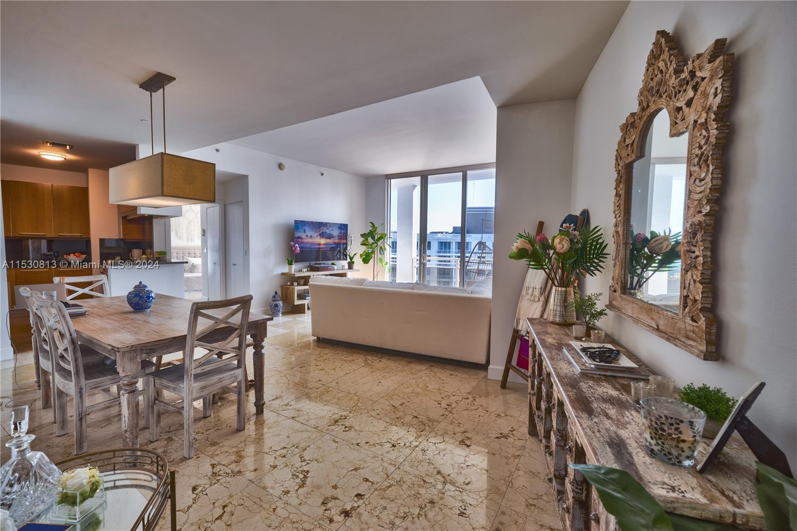 Experience this oversized 1BD 1.5BA unit in the exclusive Carbonell located on the peaceful private island of Brickell Key. Enjoy the ocean breeze from the oversized wrap-around balcony with views of Key Biscayne, Brickell Bay and the Brickell Key Park. The apartment is rented fully furnished with tasteful decor, marble floors throughout the living room, and recently installed tile wood in the bedroom. Samsung washer/dryer, plentiful storage space, walk in master closet and modern appliances allow for easy living in a luxury building with incredible amenities: world class gym, basketball+racquetball courts, large pool deck, and more. Embrace the tranquil Brickell Key lifestyle, a perfect choice for a Brickell professional or someone who can enjoy the views while work from home.