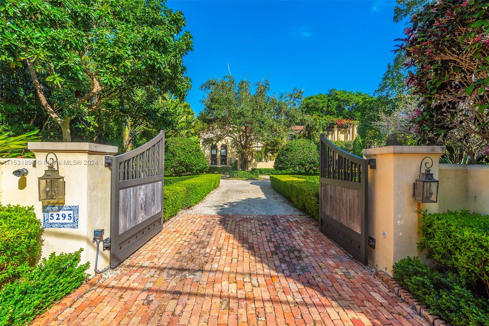 Serenely situated on the shores of Hammock Lake 2, this magnificent 6 BR, 6.5 BA 8,267 SF home looks straight out of Architectural Digest! The Cali-Mediterranean style property sits on a 43,996 SF lot in gated Hammock Lake & features stunning details throughout.  Special features include a chef’s kitchen w/ hand-painted ceiling beams, antique French mantle detail around the Wolf range, & walk-in pantry. Gorgeous arches grace the central hallway & are echoed by the impact glass doors & windows. Arabesque-shaped tile flrs feature keystone trim that flows out to the patio.  The home includes a formal living rm, dining rm, family rm, office, 2 BRs & BAs downstairs, w/ 4 BRs & BAs including the primary suite, on the 2nd floor. This is a home that must seen to be believed coveted Coral Gables!