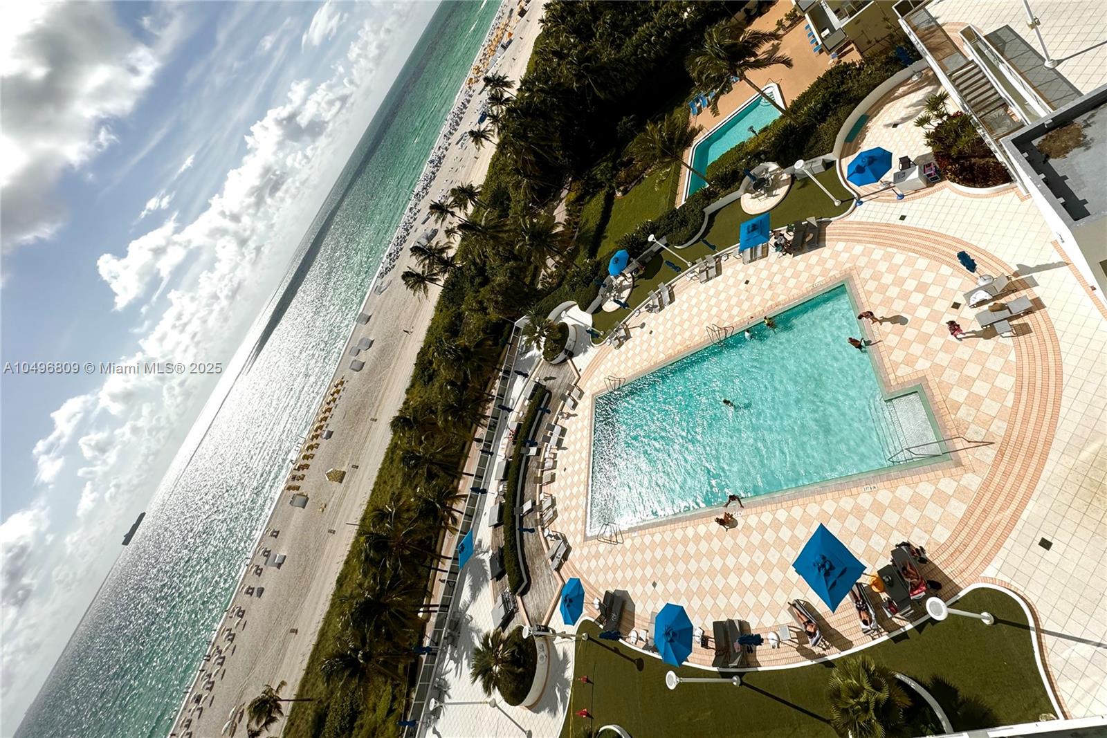 Gym with pool and ocean views